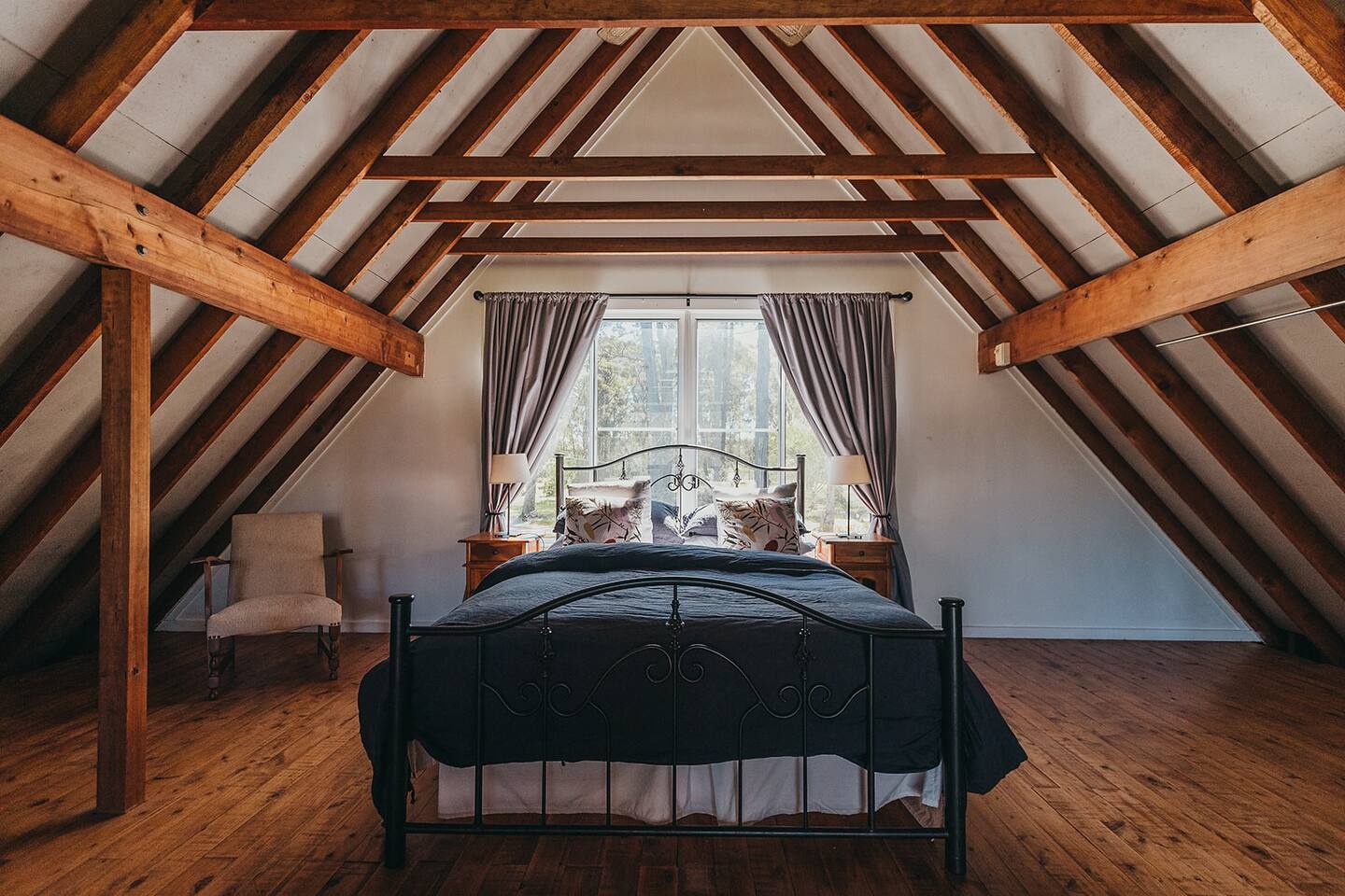 Attic wooden house with beams