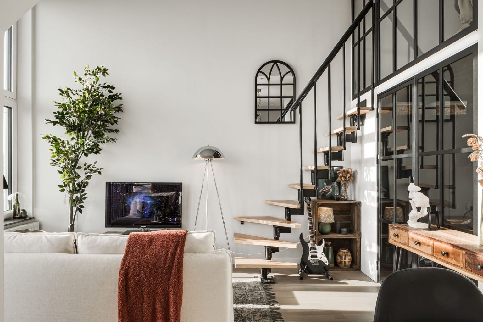 salon avec chambre en mezzanine deux-pièces en duplex de 41m2