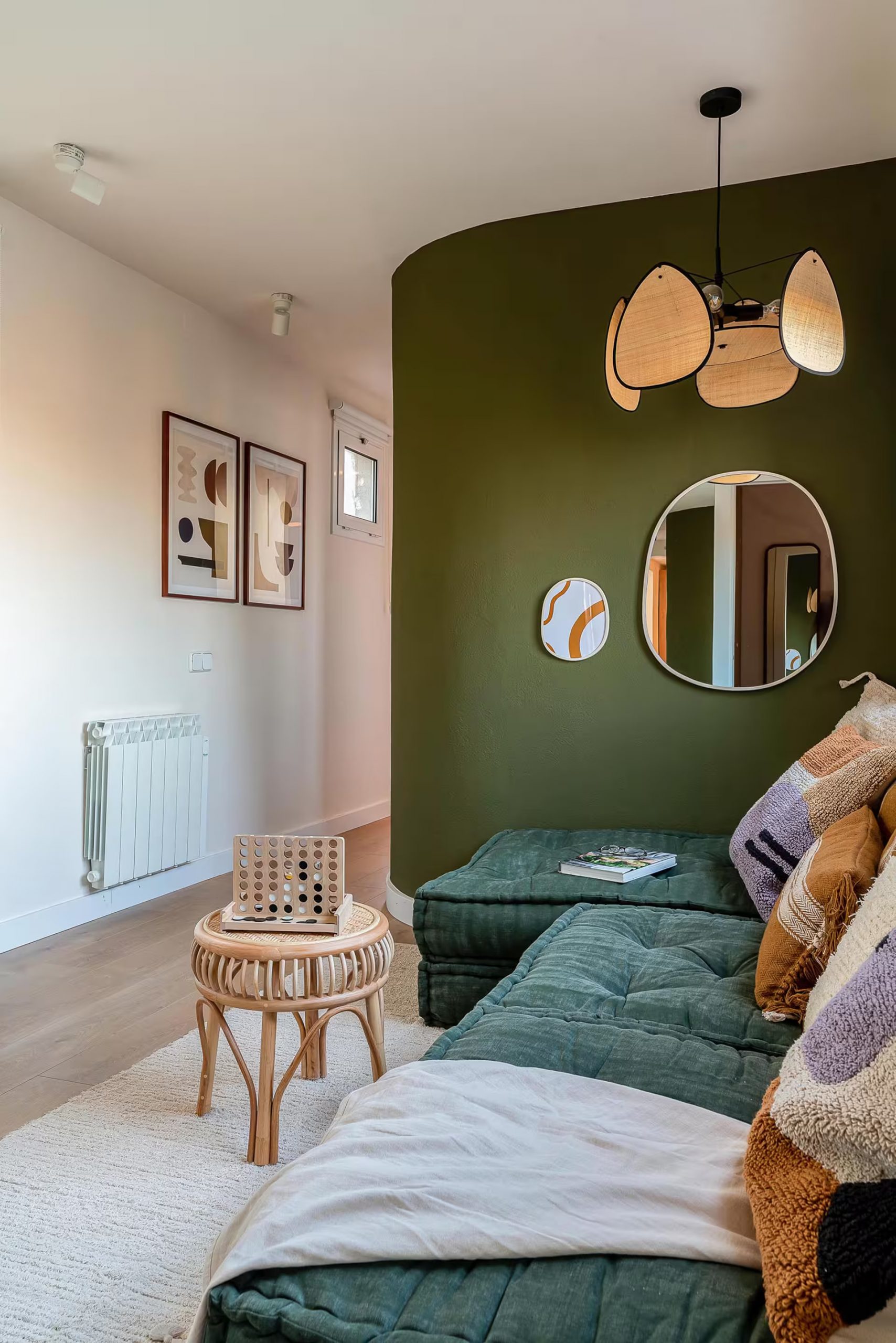 living room with sectional sofa green wall contemporary decor rooftop apartment with a terrace Barcelona living room with sectional sofa green wall contemporary decor rooftop apartment with a terrace Barcelona