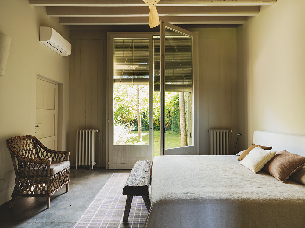 bedroom with beams rustic chic decor Mediterranean eco-friendly house Spain 