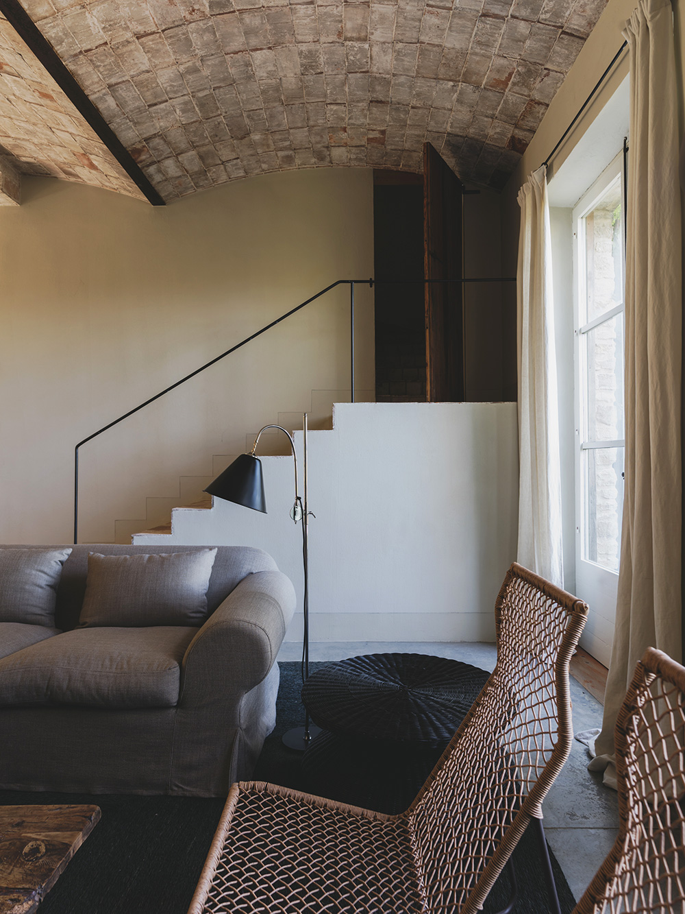 living room with stairs rustic chic decor Mediterranean and eco-friendly house Spain Catalan ceilings