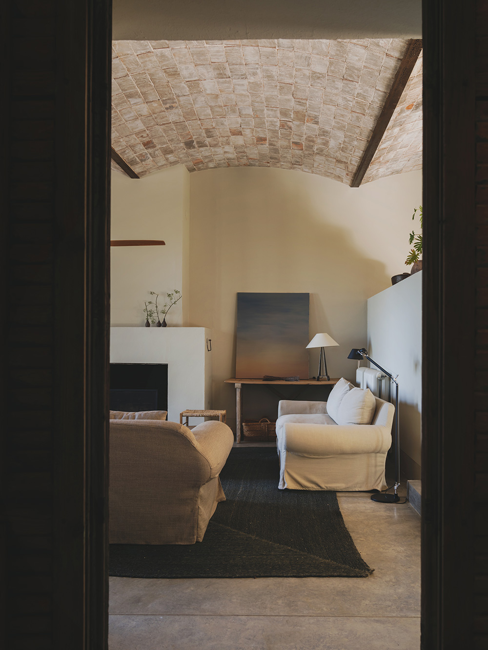living room with fireplace rustic chic decor Mediterranean and eco-friendly house Spain Catalan ceilings