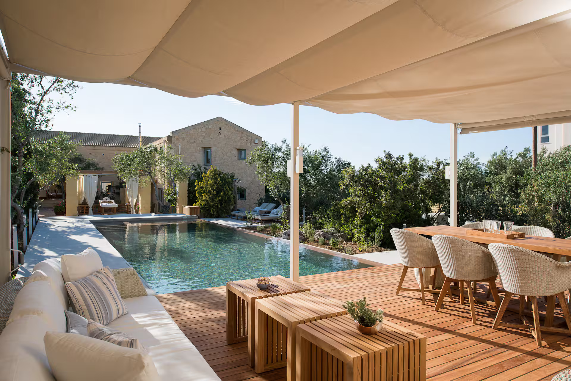 outdoor dining room with pergola stone house with swimming pool in Crete Villa Dimi outdoor dining room with pergola stone house with swimming pool in Crete Villa Dimi