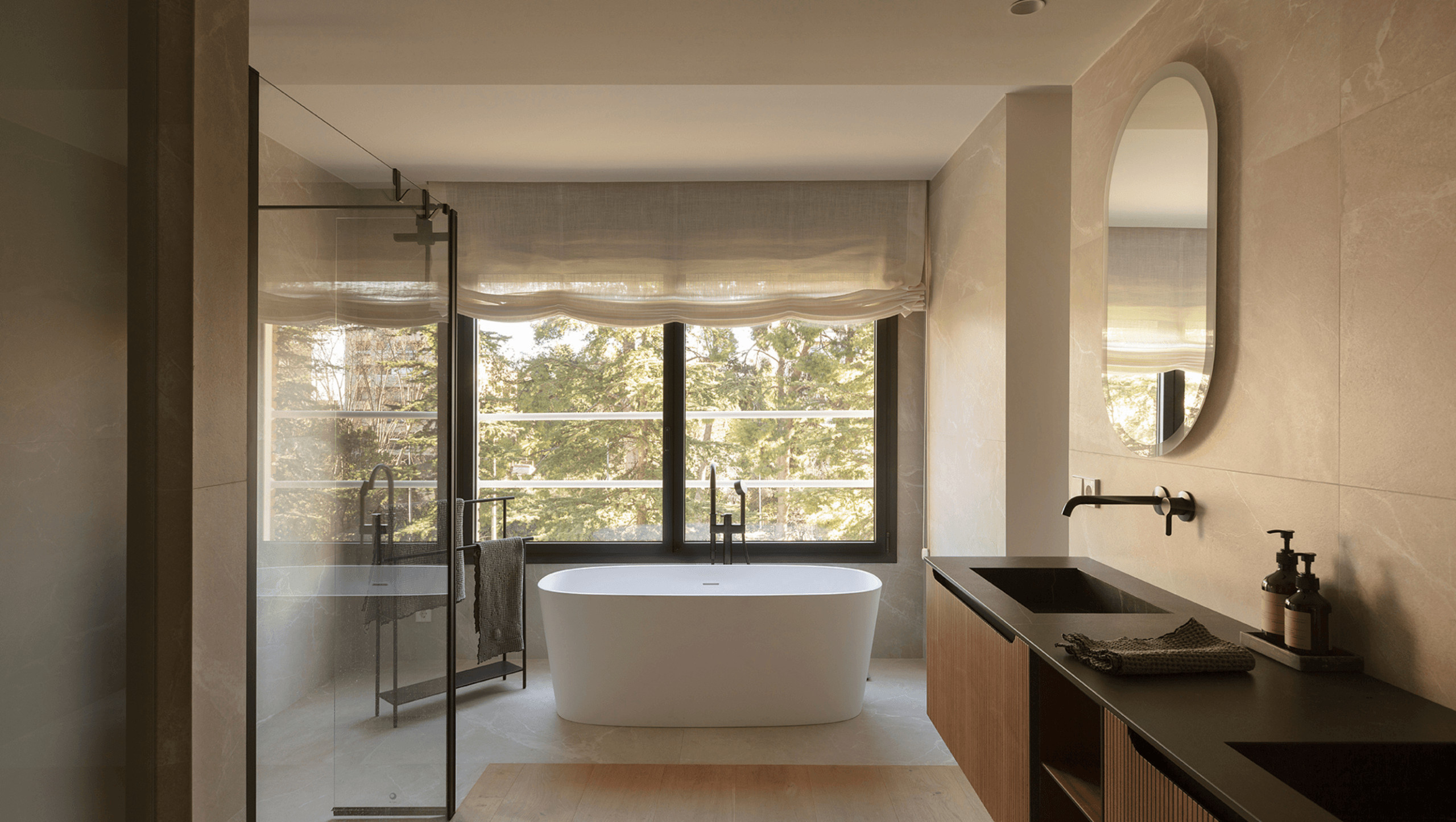 large bathroom with windows and island bathtube 