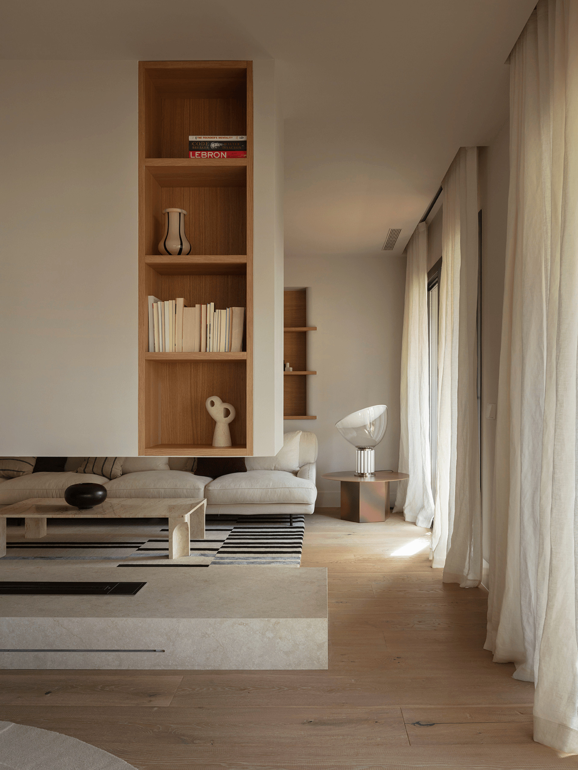 Living room with double-sided fireplace, contemporary beige decor