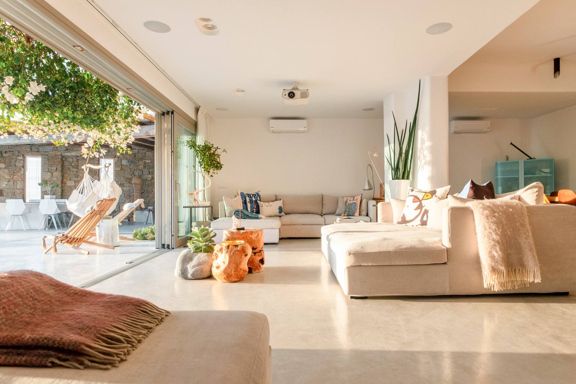 living room with bay window Mykonos house with swimming pool contemporary decor living room with bay window Mykonos house with swimming pool contemporary decor