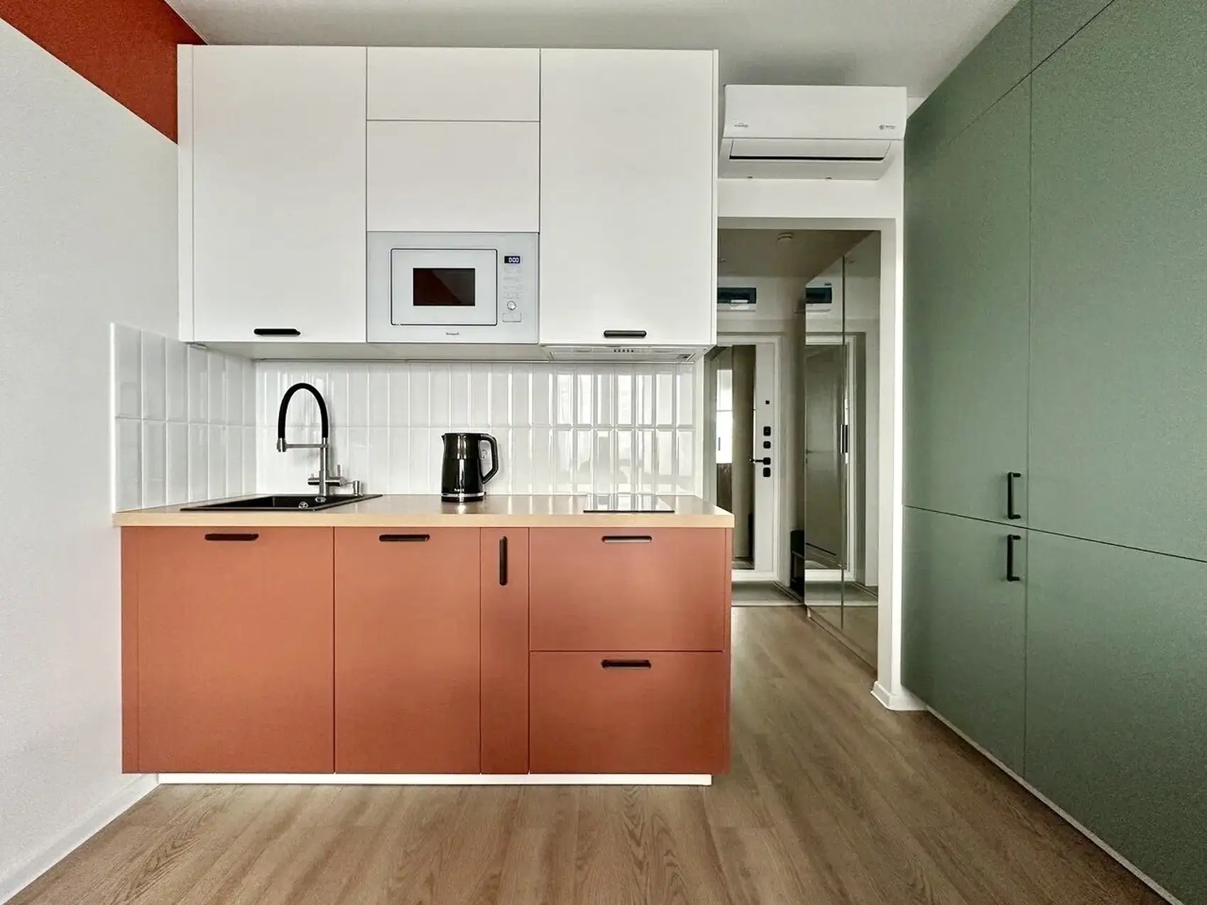 green and terracotta kitchen 19m2 studio coloured decor