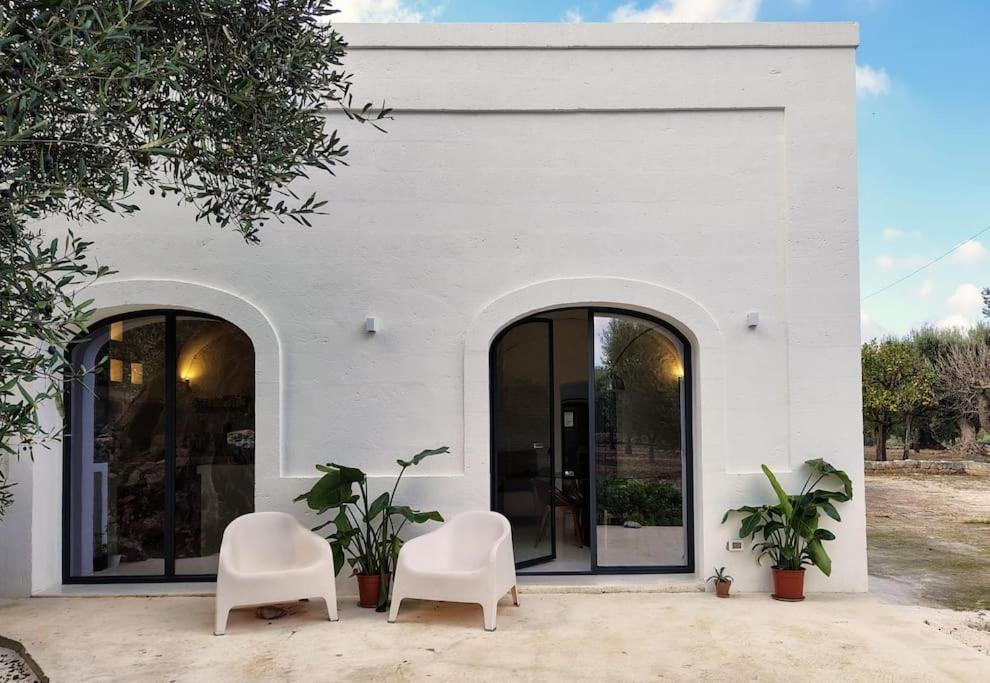 This white Apulian house blends old-world charm with modern comfort