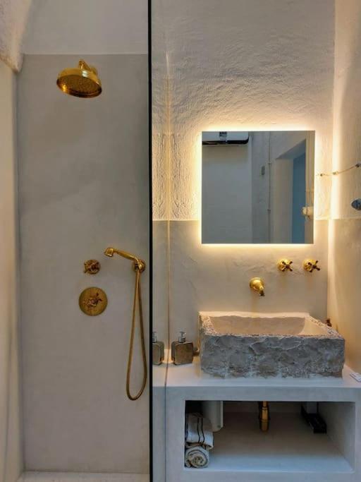 rustic chic bathroom with stone sink Casa Lama Monopoli