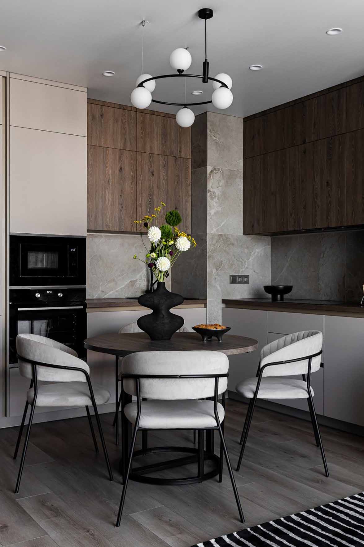 opent kitchen an living room with white sofa and black and white rug, 60m2 neutral flat opent kitchen an living room with white sofa and black and white rug, 60m2 neutral flat