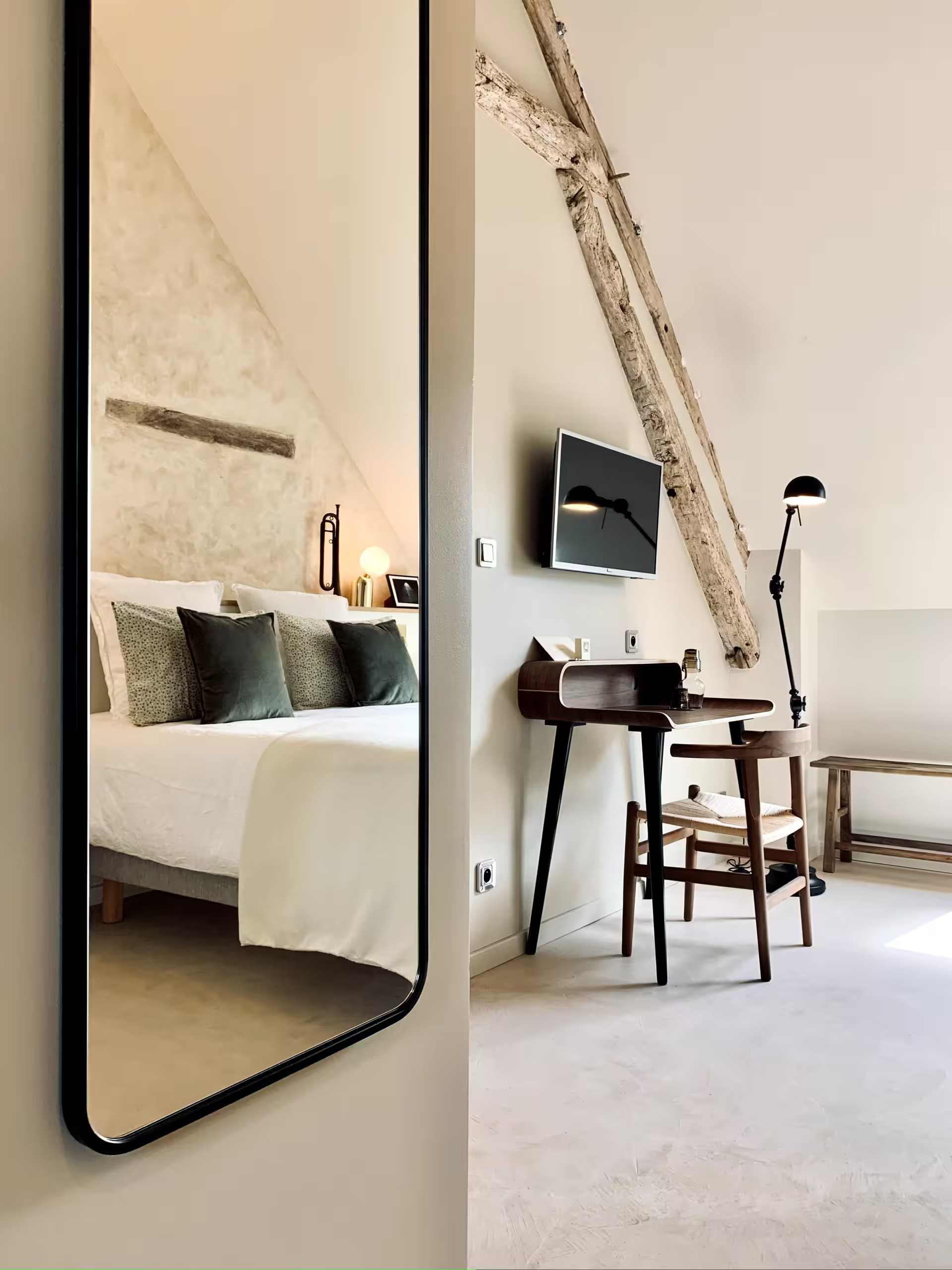 attic bedroom with beams rustic chic decor countryside France La Clef des Champs
