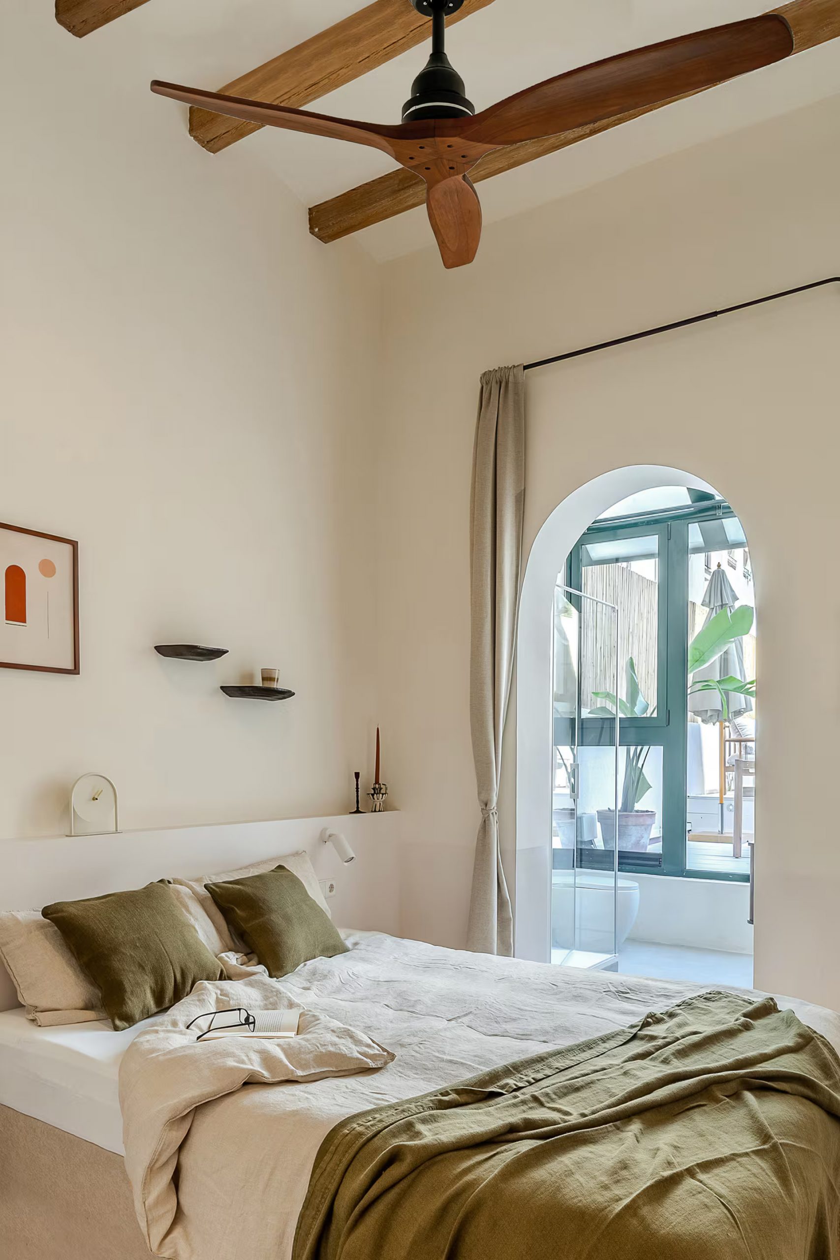 white and green bedroom with beams