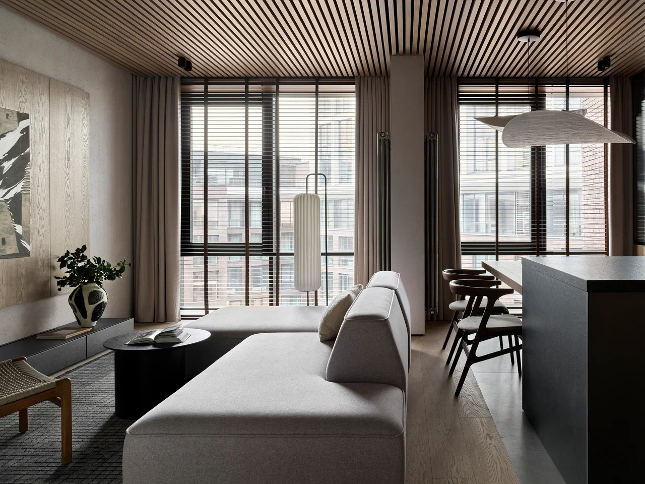 living room with grey sofa and opten walnut kitchen designer decor flat