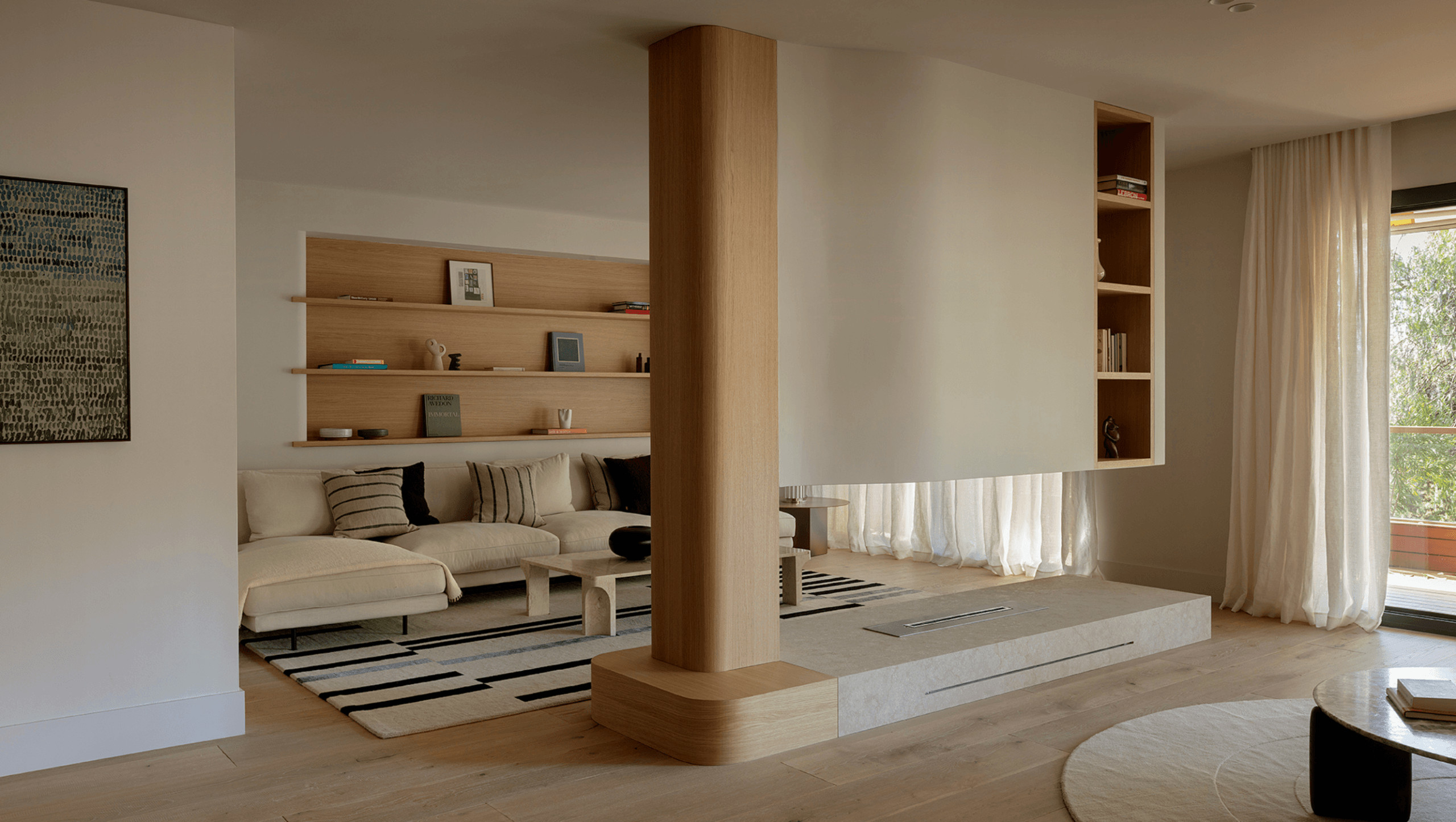 Living room with double-sided fireplace, contemporary beige decor