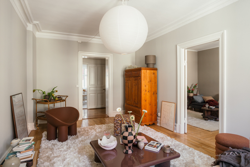 living room with mouldings scandinavian decor brown Roly Poly armchair living room with mouldings scandinavian decor brown Roly Poly armchair