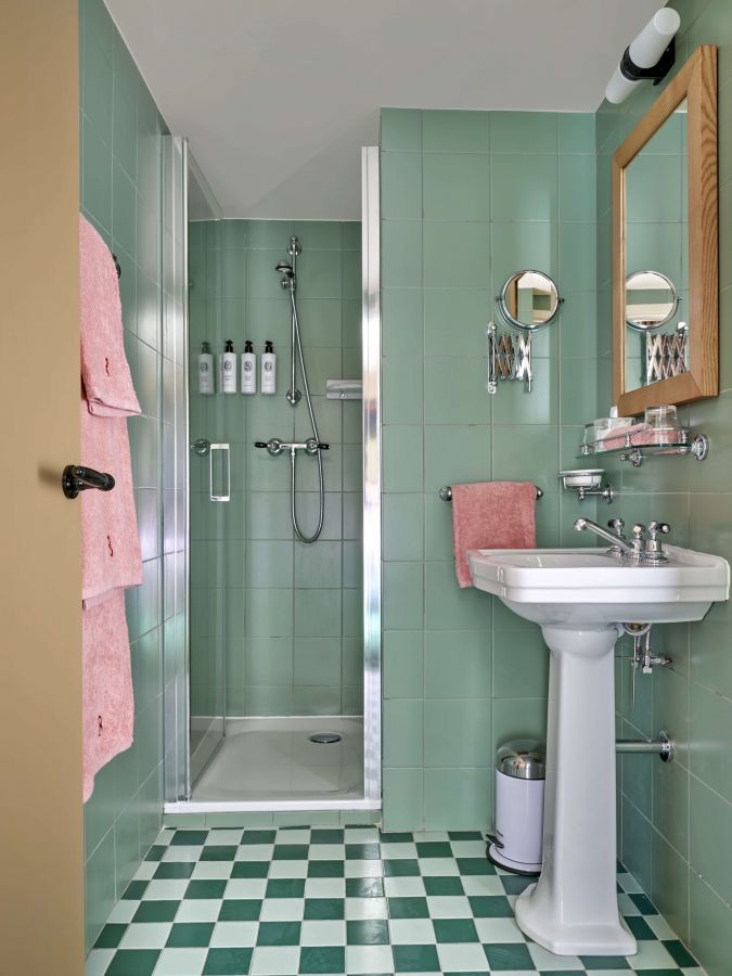 green bathroom with checkered floor by Beata Heuman in Hotel La Boétie Paris green bathroom with checkered floor by Beata Heuman in Hotel La Boétie Paris