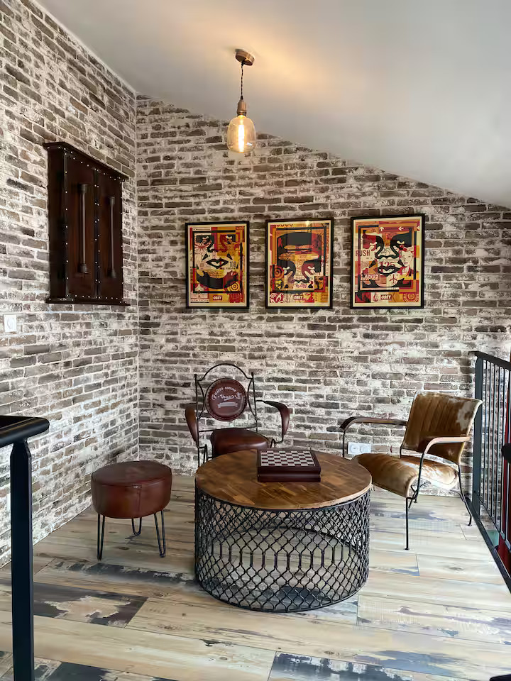 living room on mezzanine industrial loft style with bricks Royan France Atlantic Coast living room on mezzanine industrial loft style with bricks Royan France Atlantic Coast