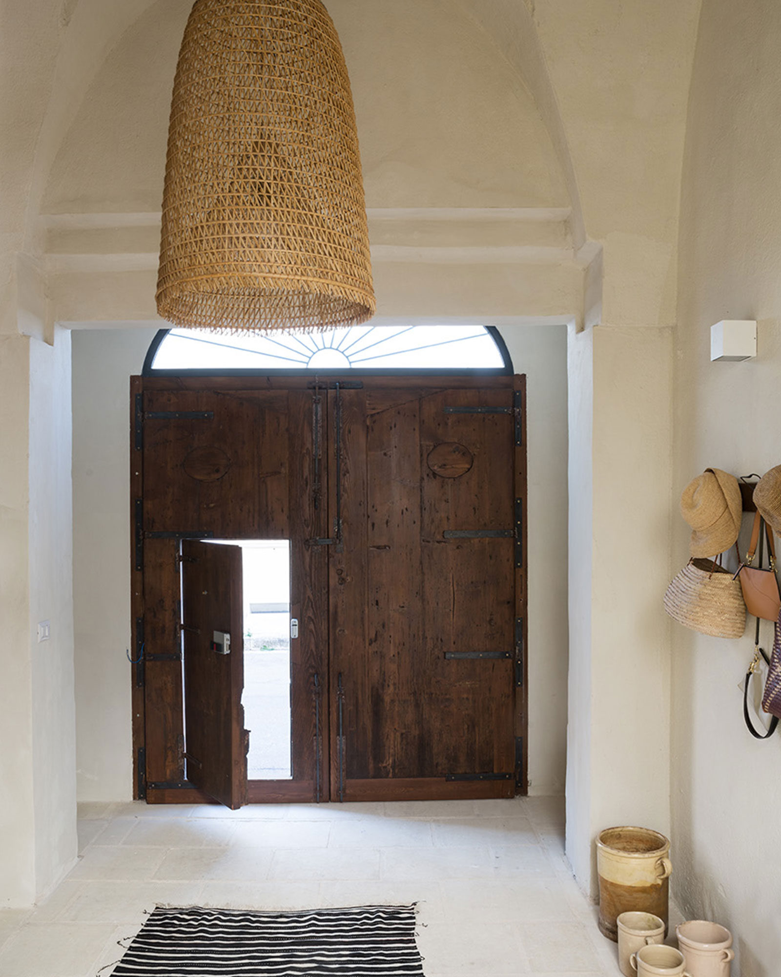entryway with arches renovated historic townhouse in Puglia modern decor