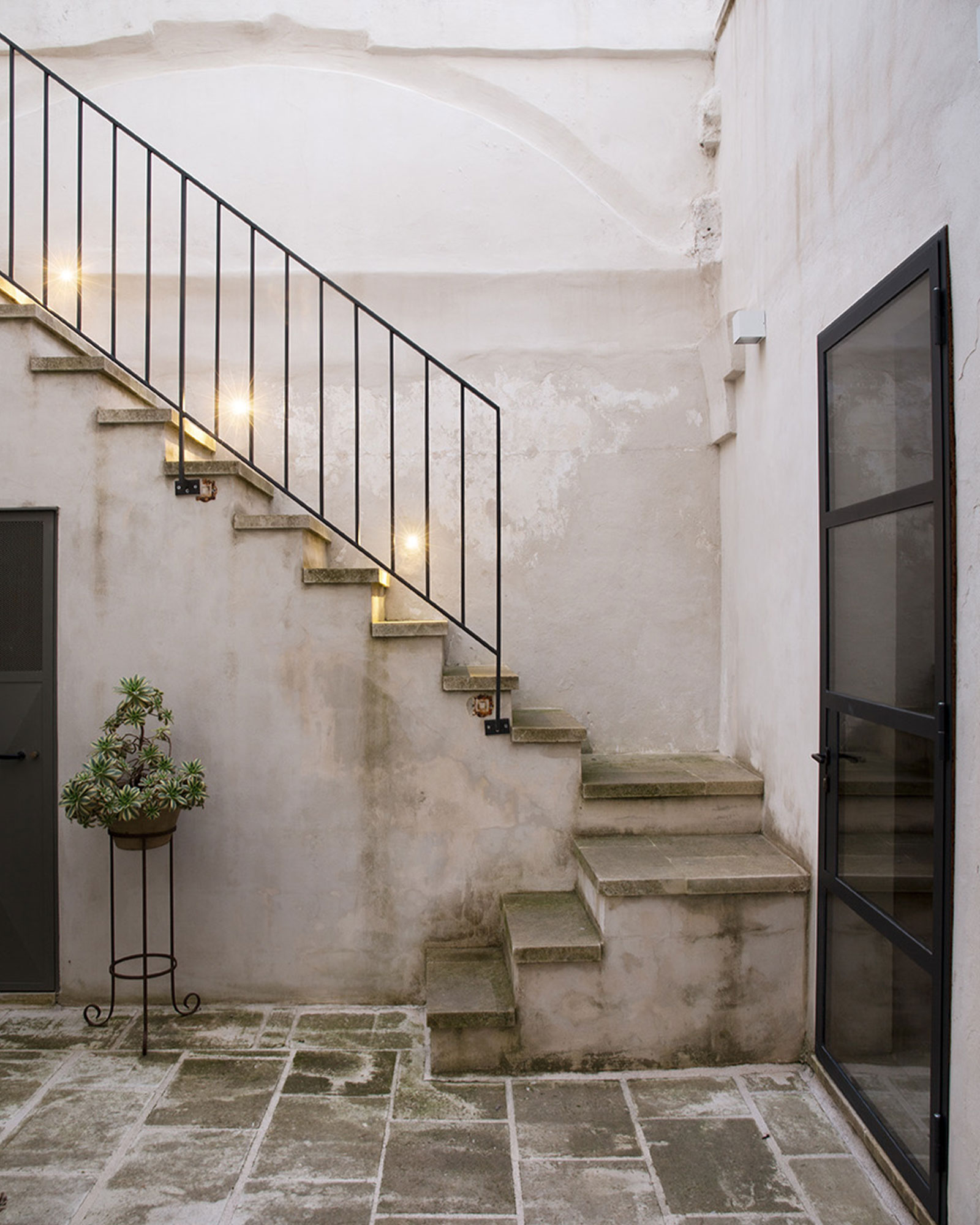 terrace with stairs renovated historic townhouse in Puglia