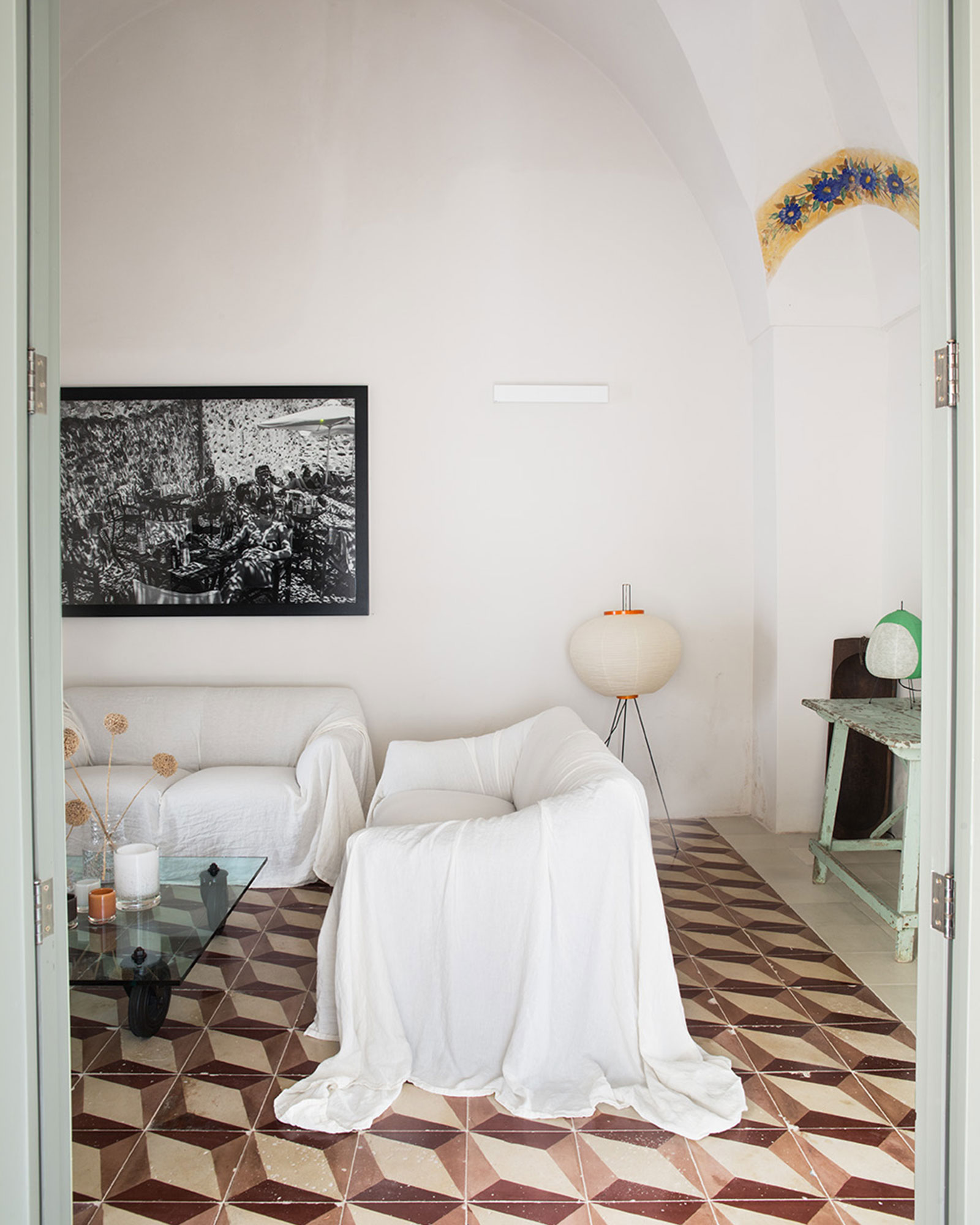 white living room with arches renovated historic townhouse in Puglia modern decor