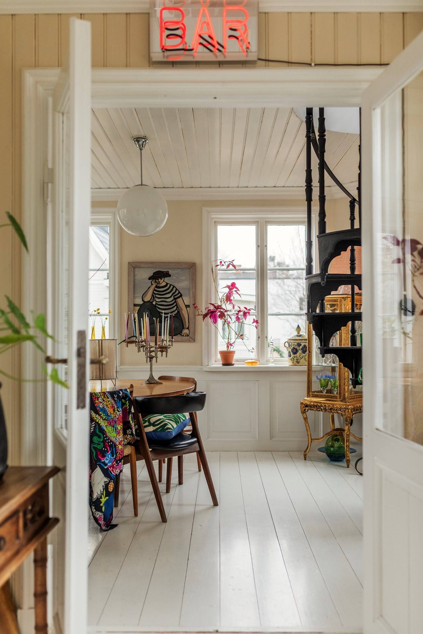 dining room with spiral black metal staircase period house in Sweden scandinavian decor dining room with spiral black metal staircase period house in Sweden scandinavian decor
