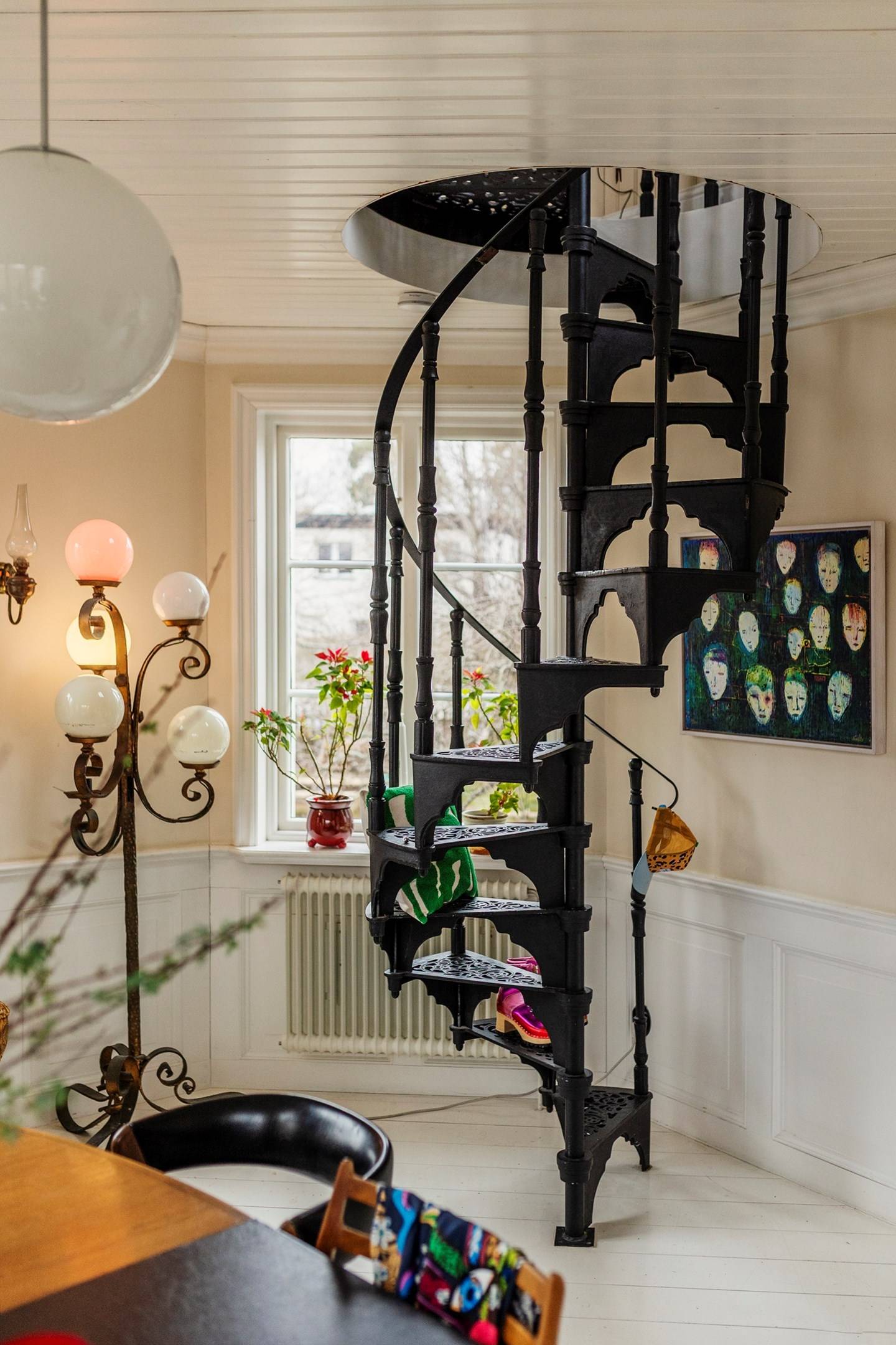 dining room with spiral black metal staircase period house in Sweden scandinavian decor dining room with spiral black metal staircase period house in Sweden scandinavian decor