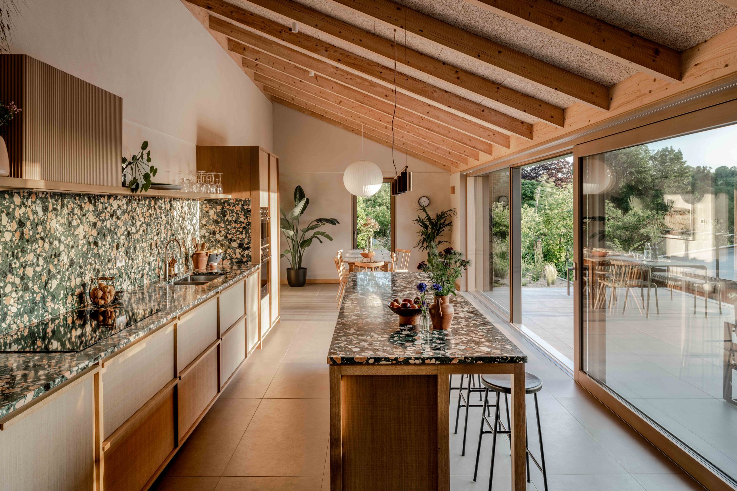 Contemporary kitchen decor with marble and wood in a wooden house