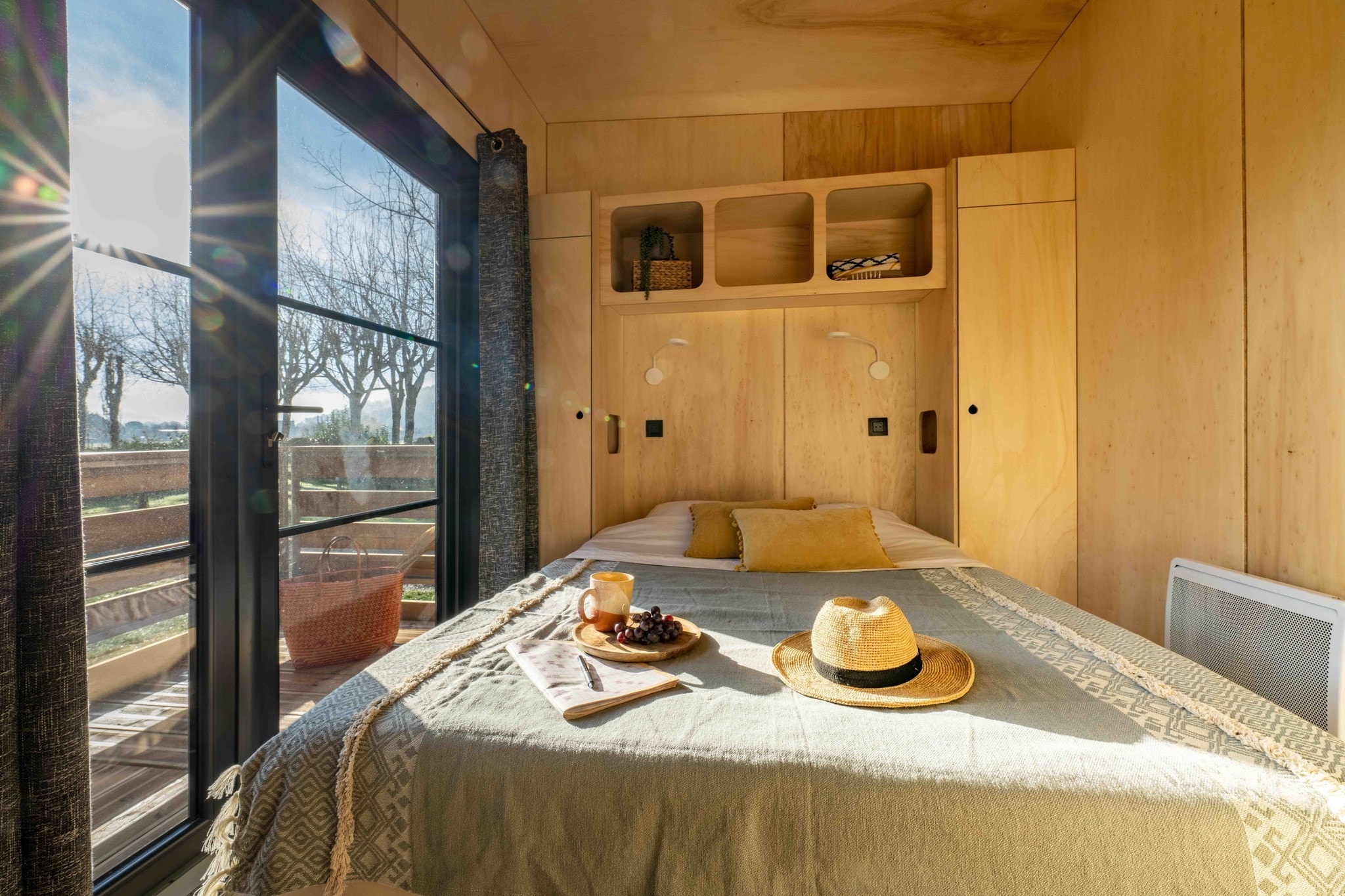 bedroom with cupboards wooden walls