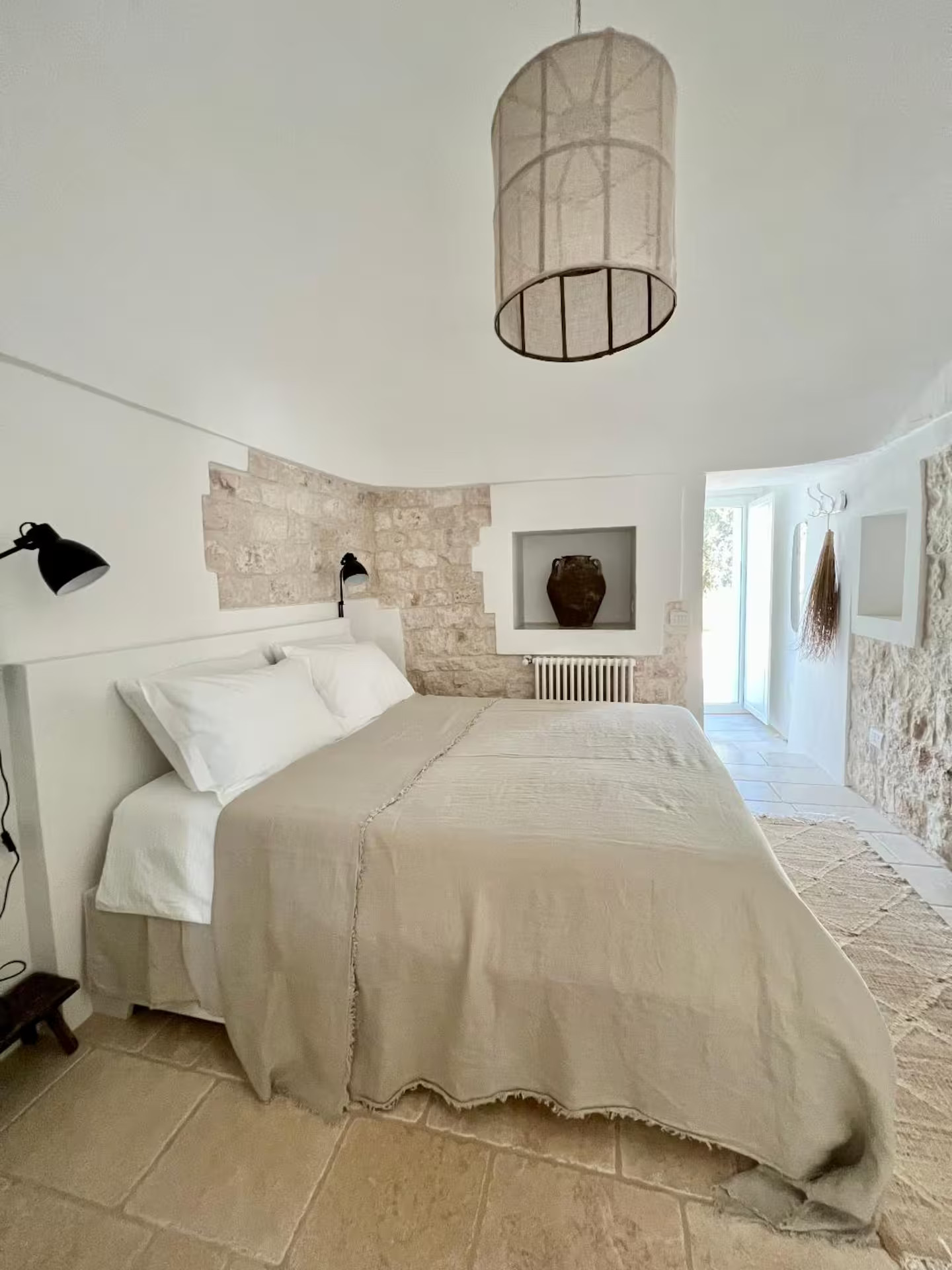 bedroom with stone walls Trullo Falco