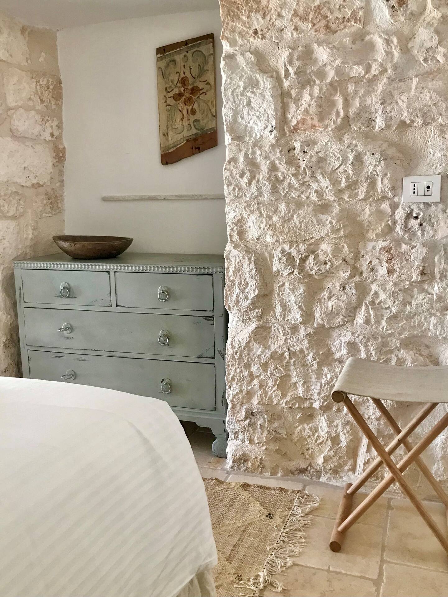 bedroom with stone walls Trullo Falco