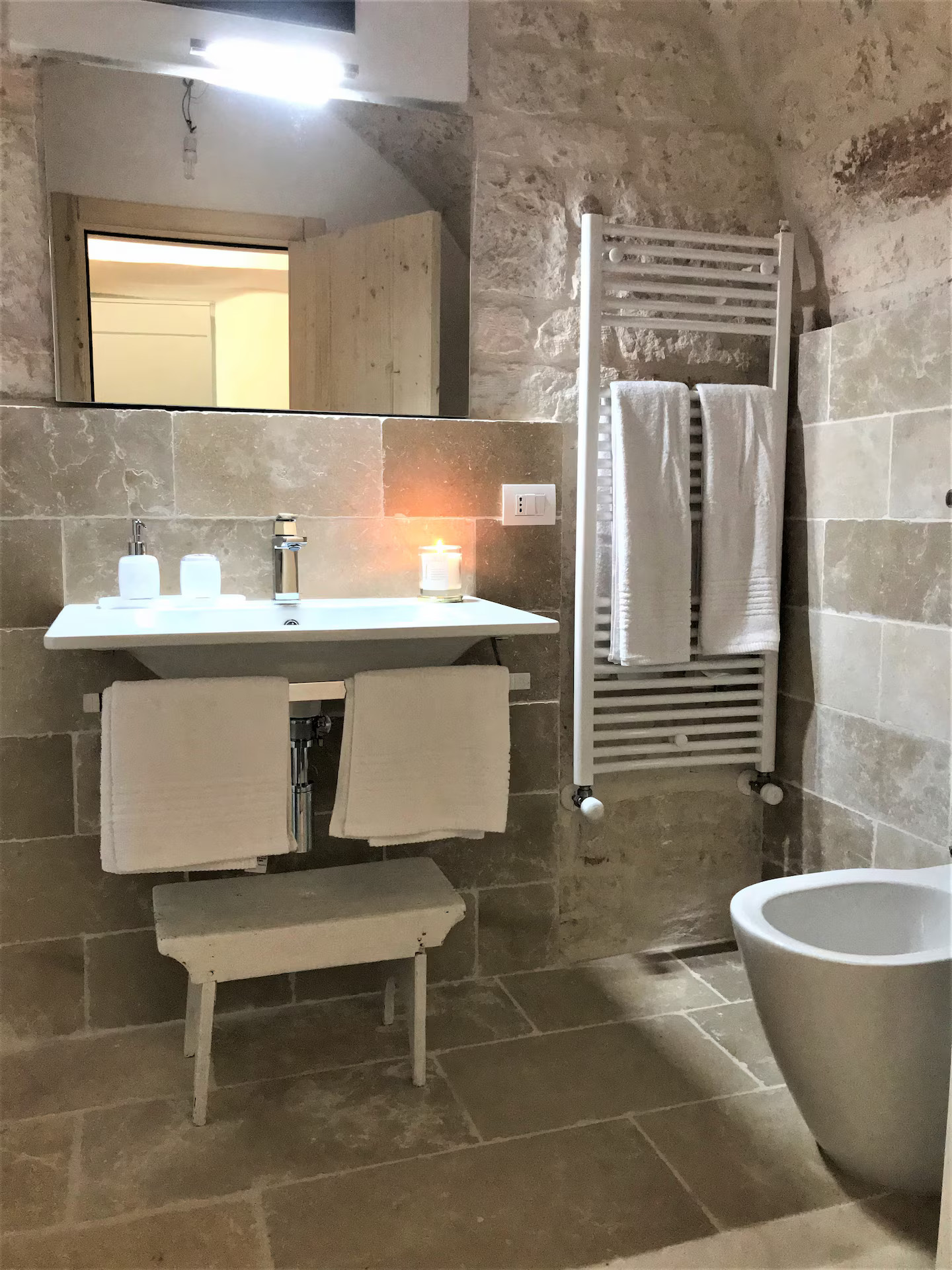 bathroom with stone walls Trullo Falco