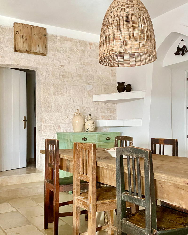 dining room stone walls rustic chic decor renovated trullo in Puglia Trullo Falco