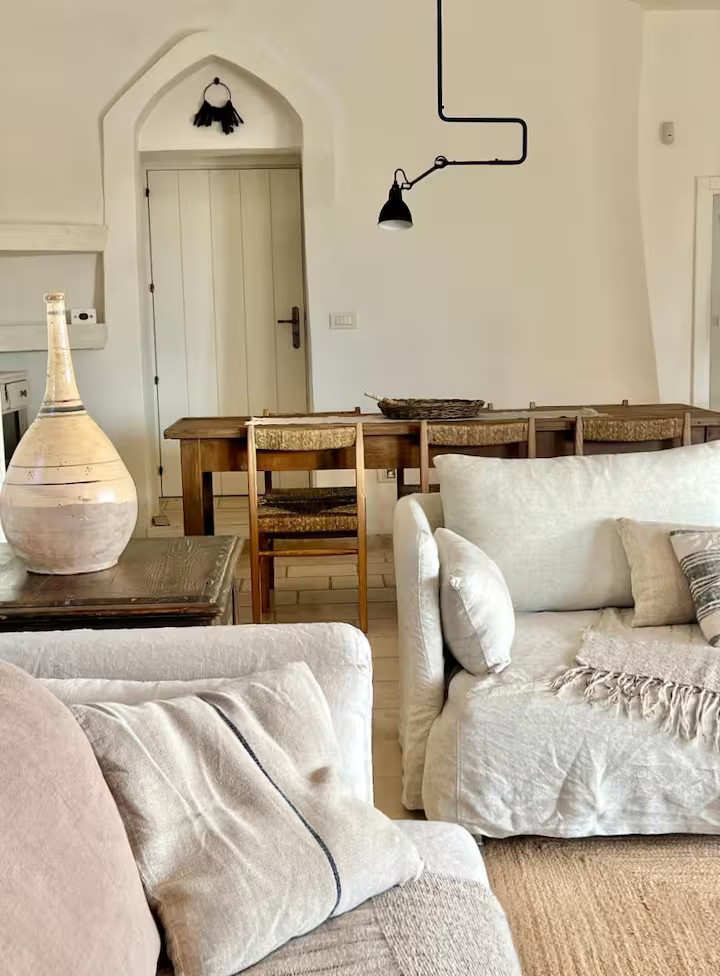living room and dining room rustic chic decor renovated trullo in Puglia Trullo Falco