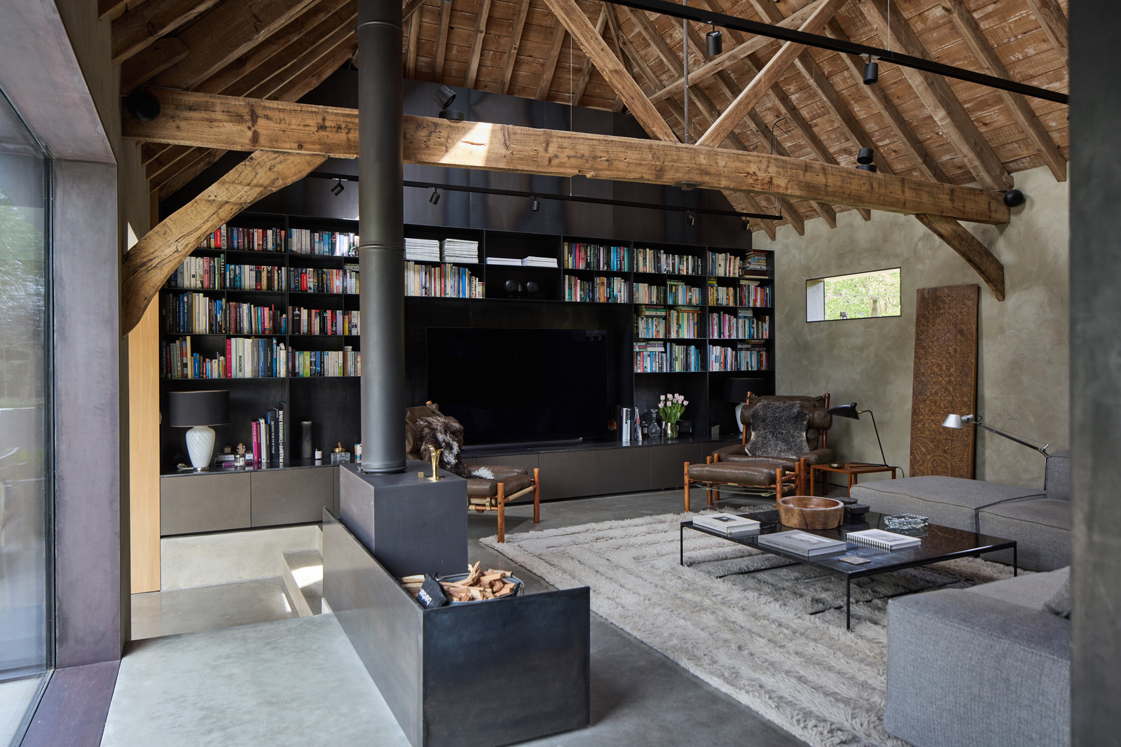 living room with beams and stove contemporary decor former English barn renovated