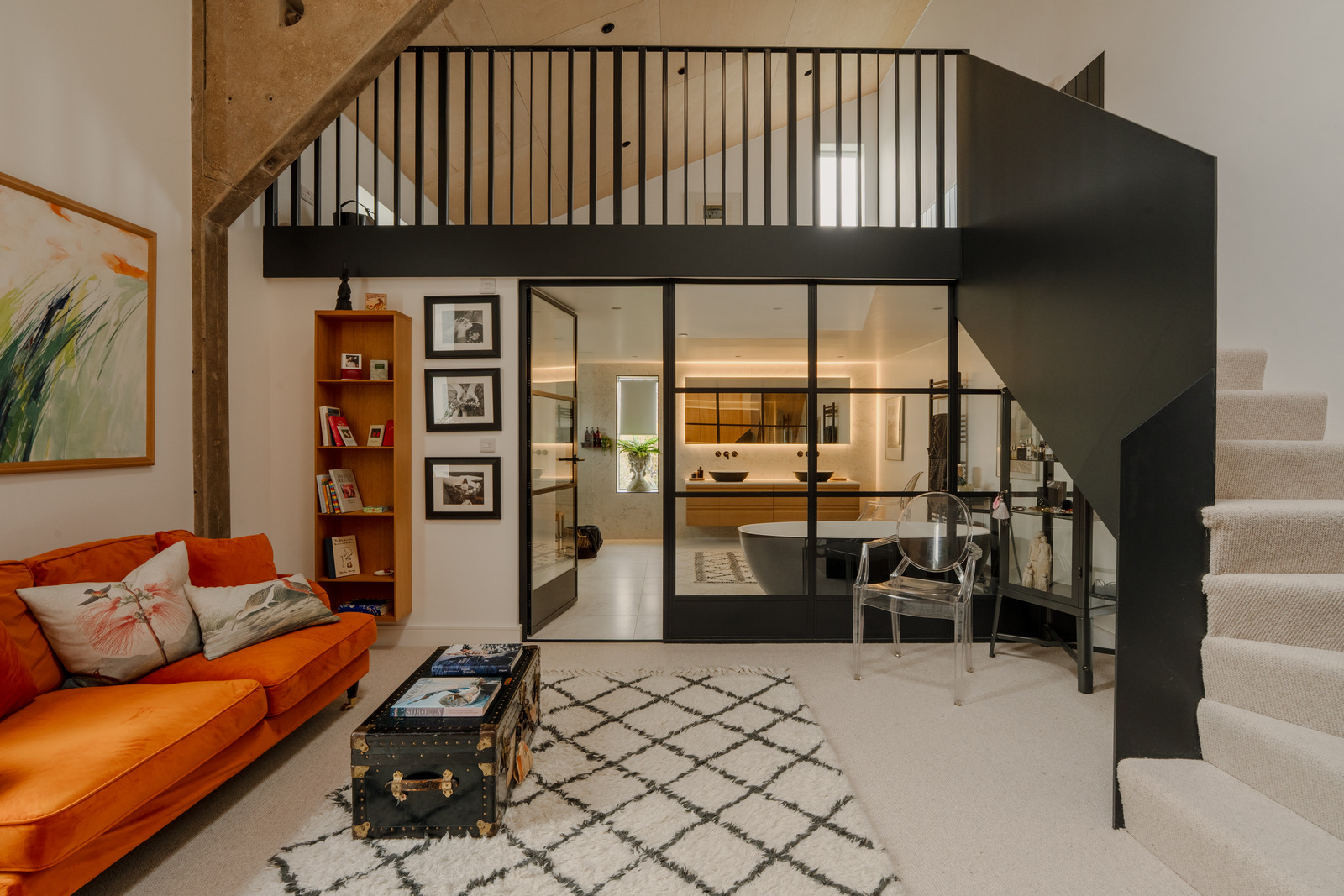 living room with mezzanine and staircase