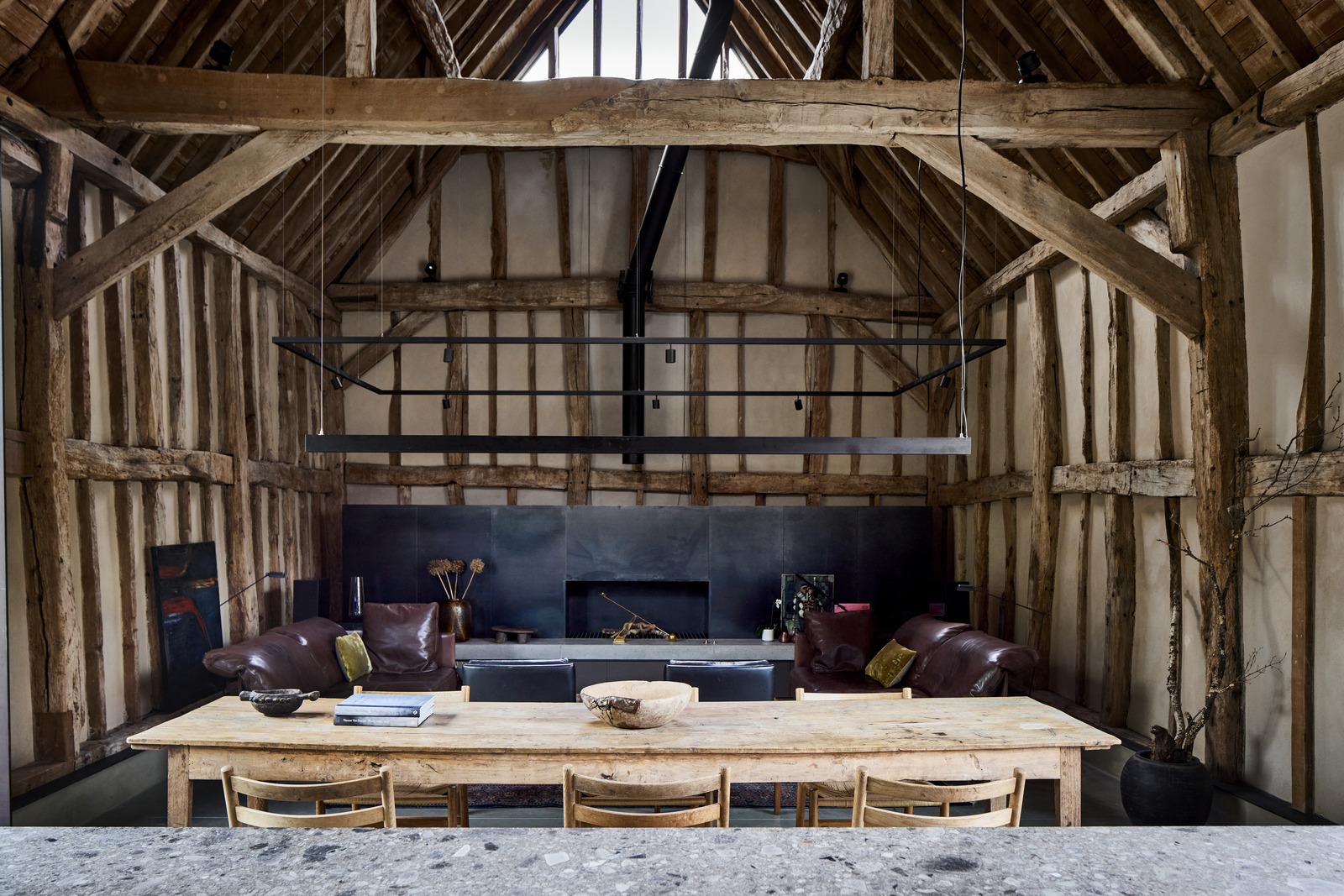 open kitchen dining room and living room with beams contemporary decor former English barn renovated