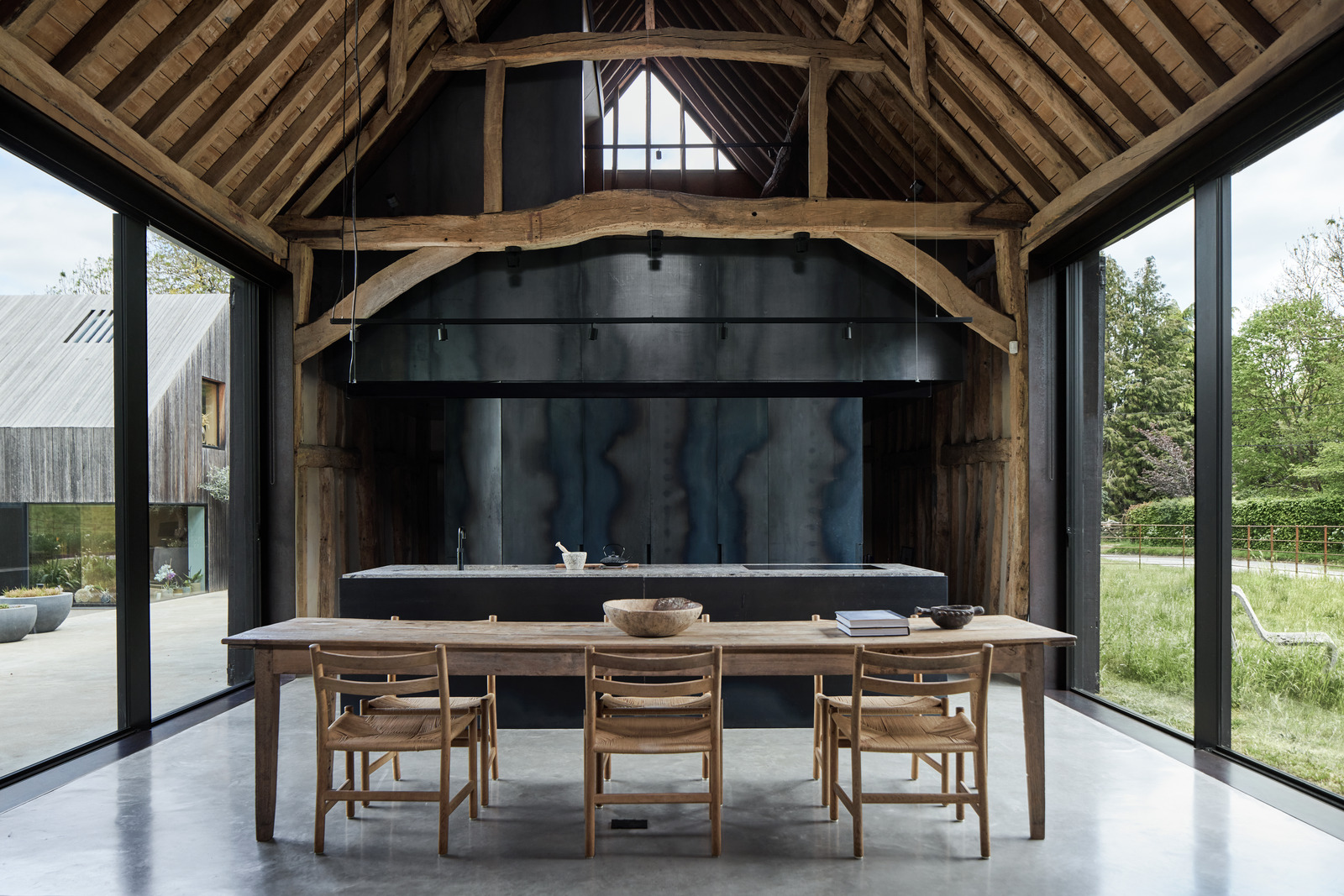 open kitchen dining room with beams contemporary decor former English barn renovated