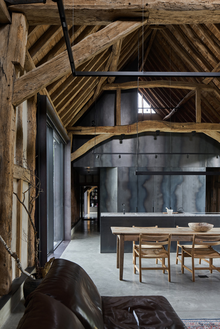 open kitchen dining room and living room with beams contemporary decor former English barn renovated