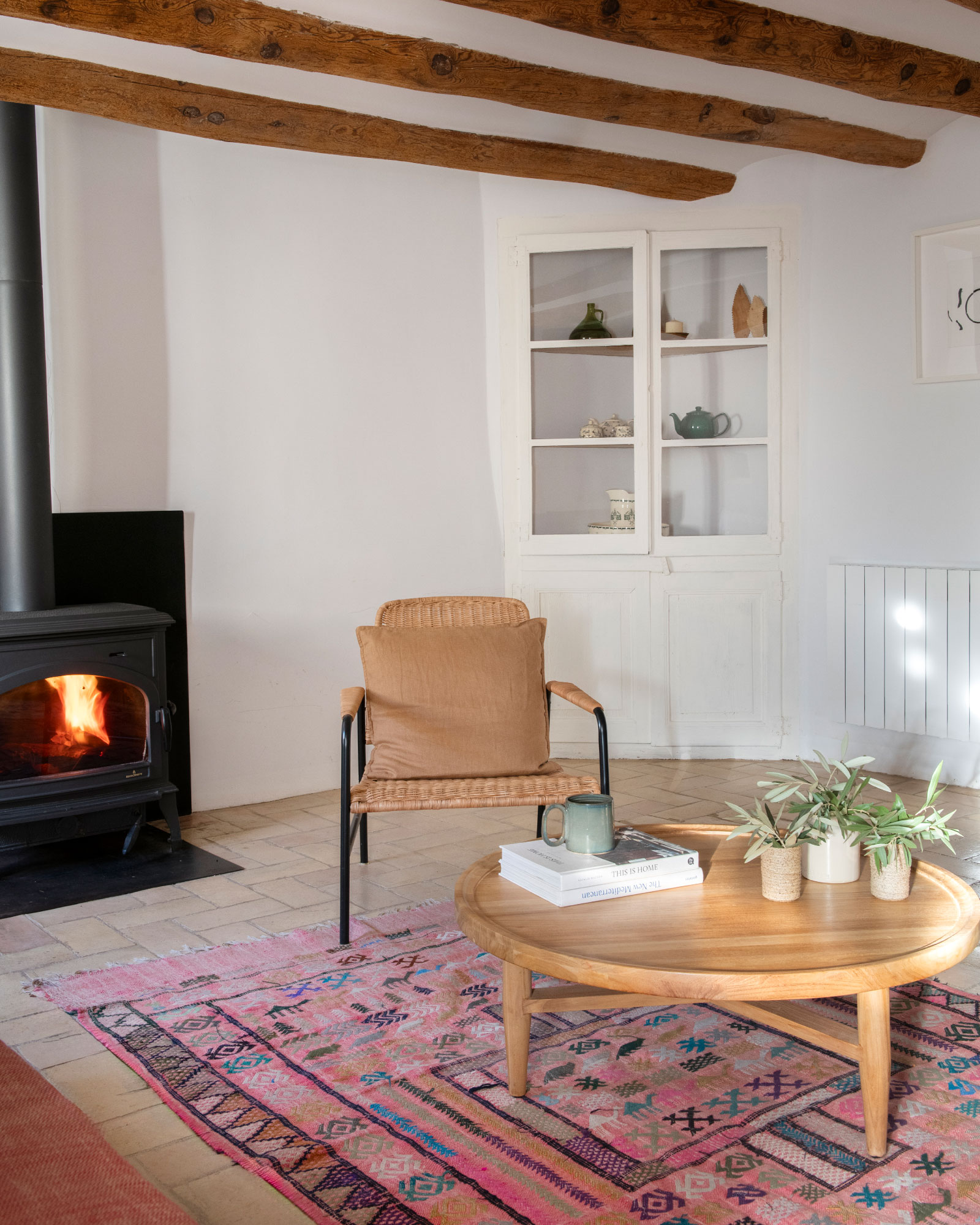 living room with beams and stove Catalan village house Casa Maltesa