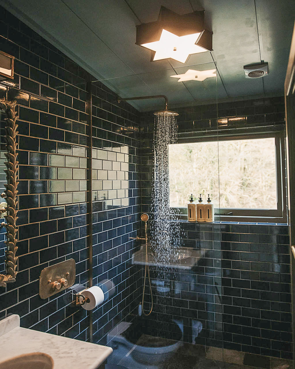 green tiled bathroom small house UKAI by HÁM Interiors