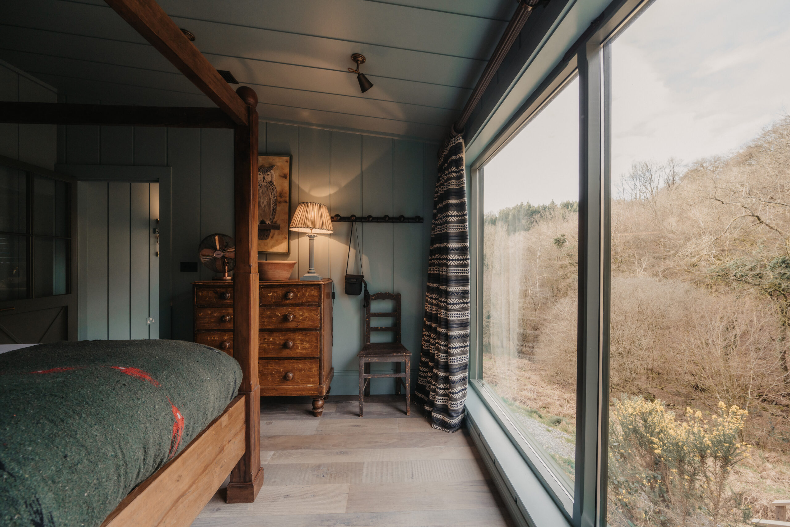 bedroom with four-poster bed dark rustic chic decor small English cottage UKAI by HÁM Interiors