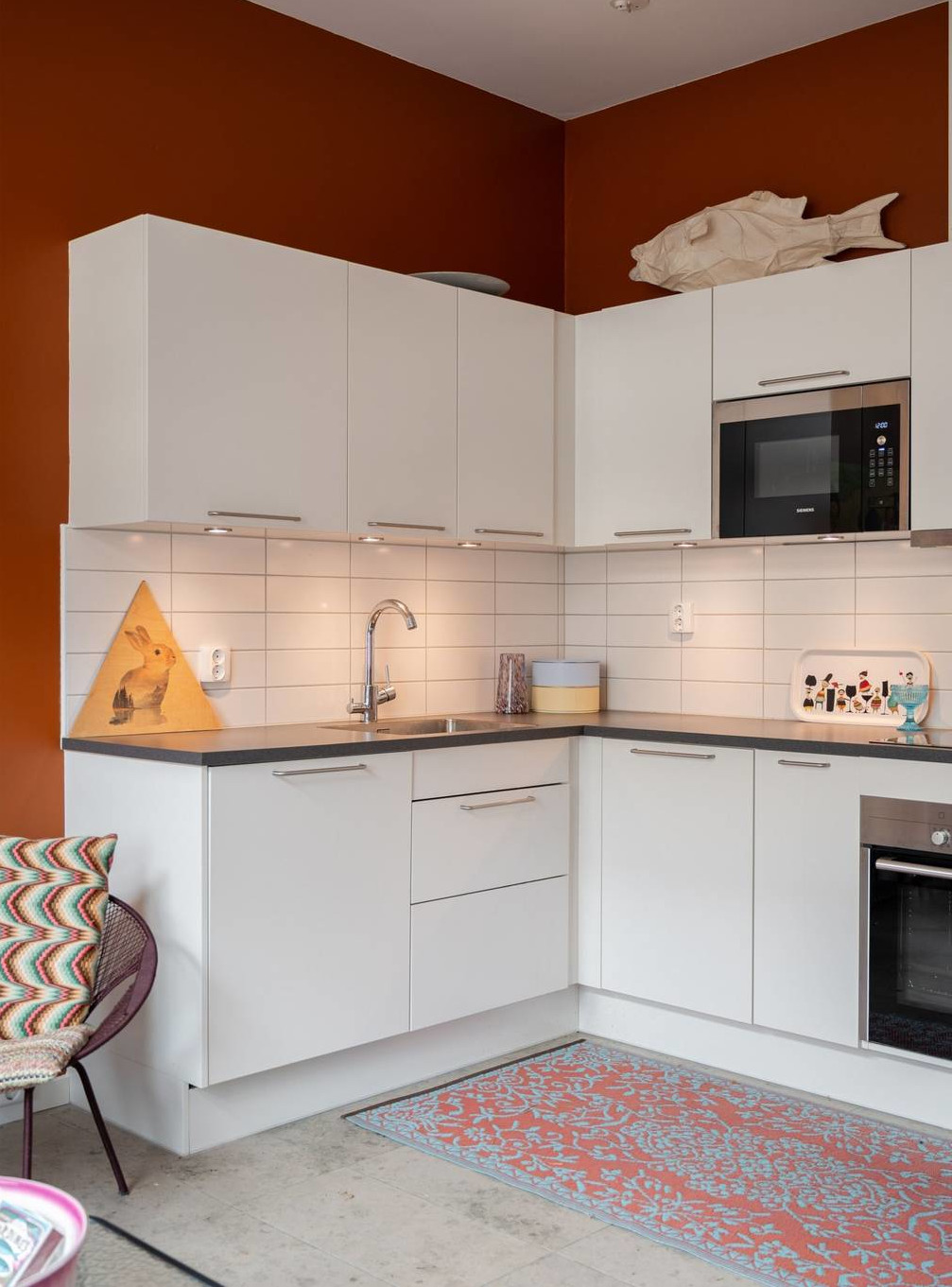 white open kitchen terracotta walls