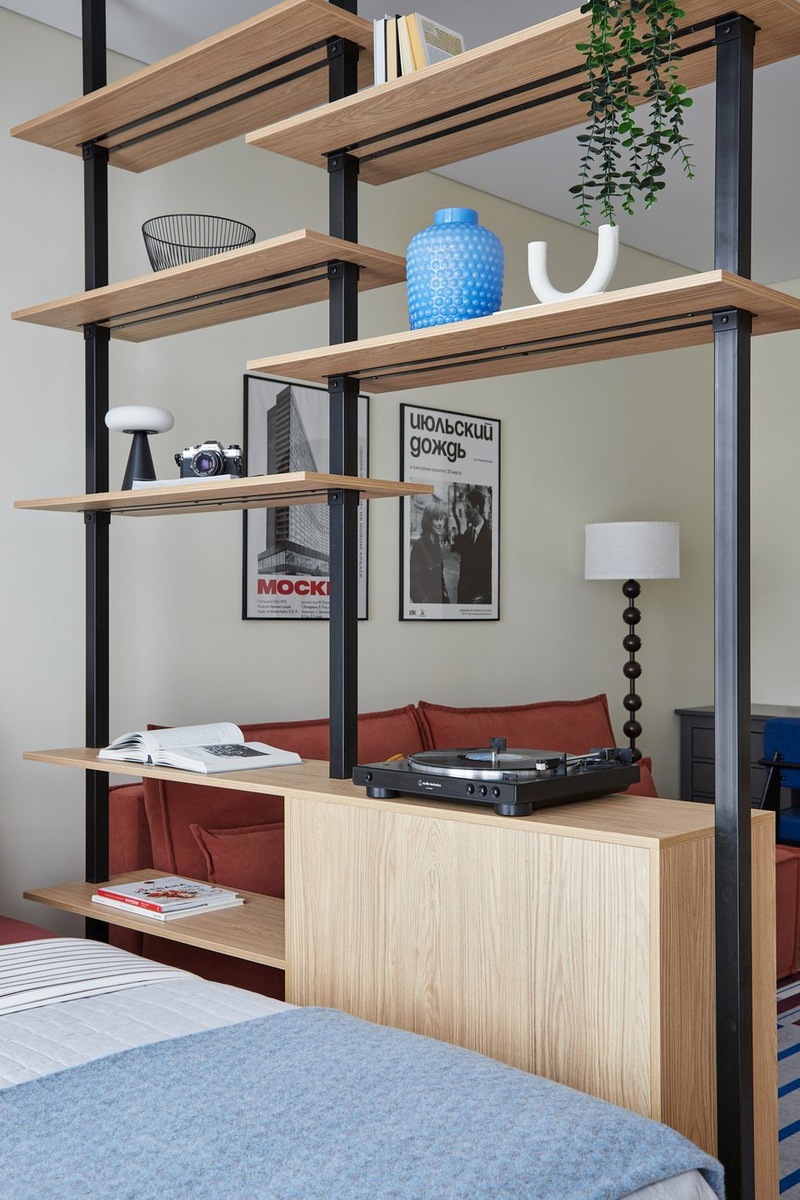 bedroom and living room with brick-red sofa contemporary decor 36sqm studio bedroom and living room with brick-red sofa contemporary decor 36sqm studio