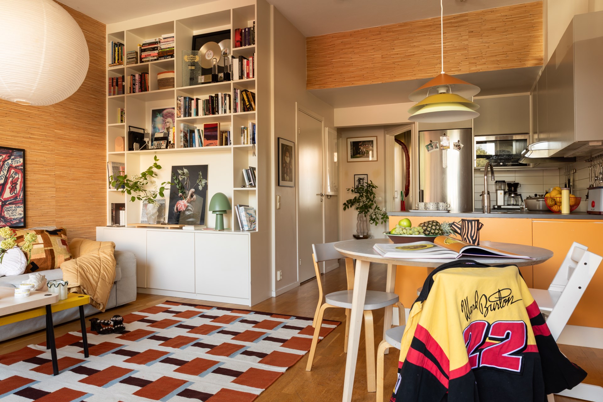 open yellow kitchen dining room and living room with an IKEA Stockholm 2025 collection rug Scandinavian vintage decor open yellow kitchen dining room and living room with an IKEA Stockholm 2025 collection rug Scandinavian vintage decor