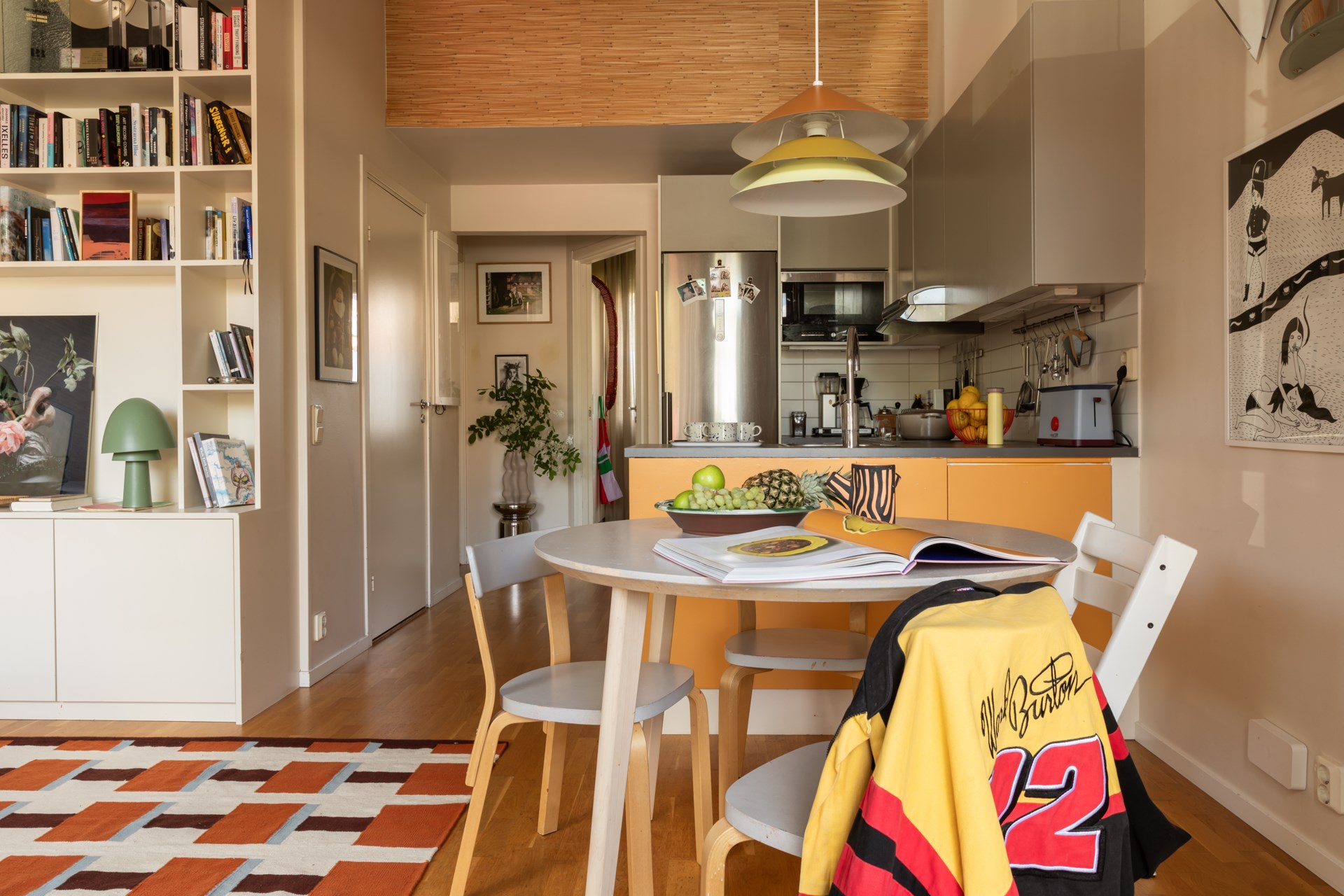 open yellow kitchen dining room and living room with an IKEA Stockholm 2025 collection rug Scandinavian vintage decor open yellow kitchen dining room and living room with an IKEA Stockholm 2025 collection rug Scandinavian vintage decor