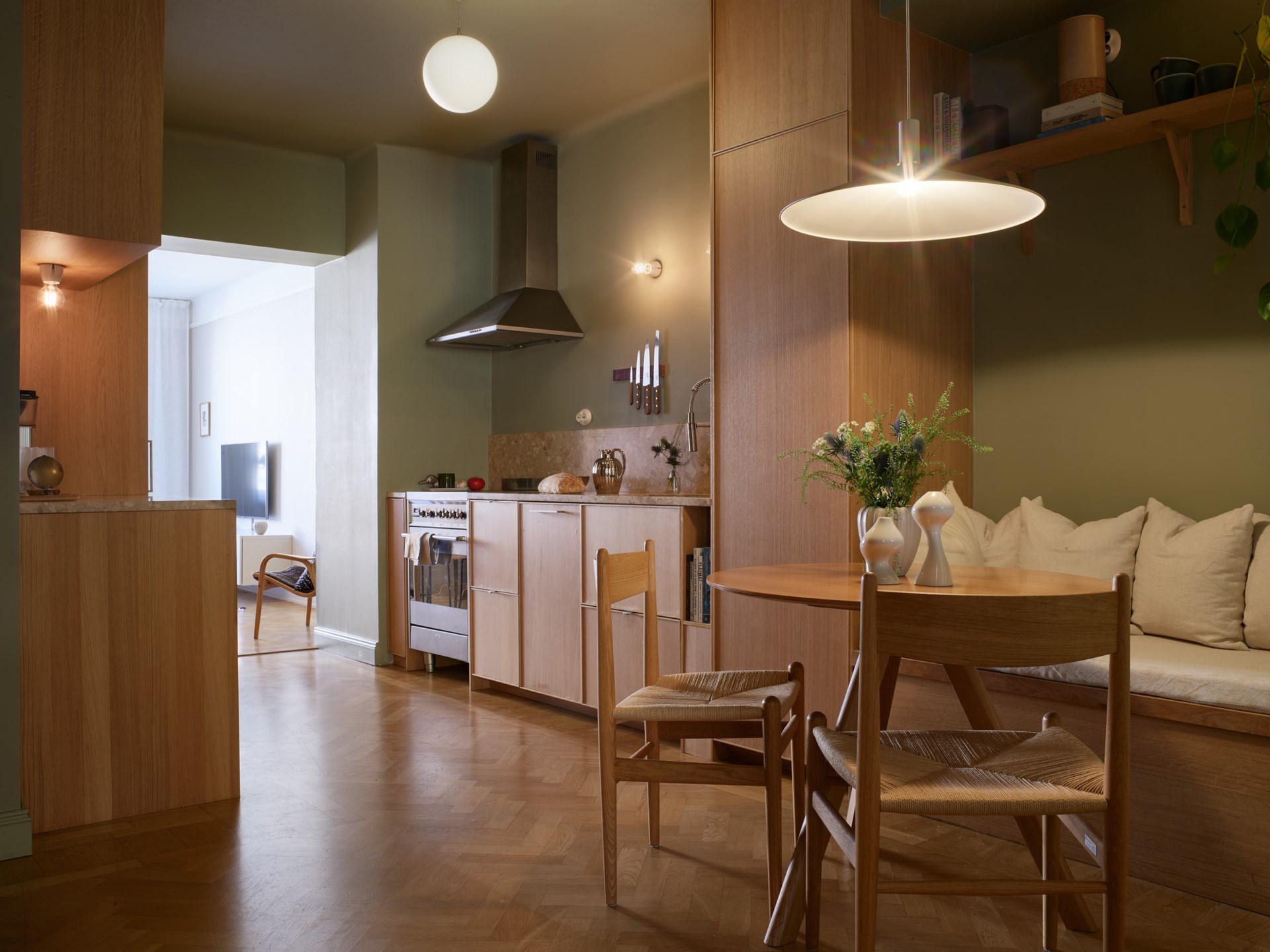 oak kitchen with green walls and bespoke dining room scandinavian decor in a 66sqm three-room apartment oak kitchen with green walls and bespoke dining room scandinavian decor in a 66sqm three-room apartment