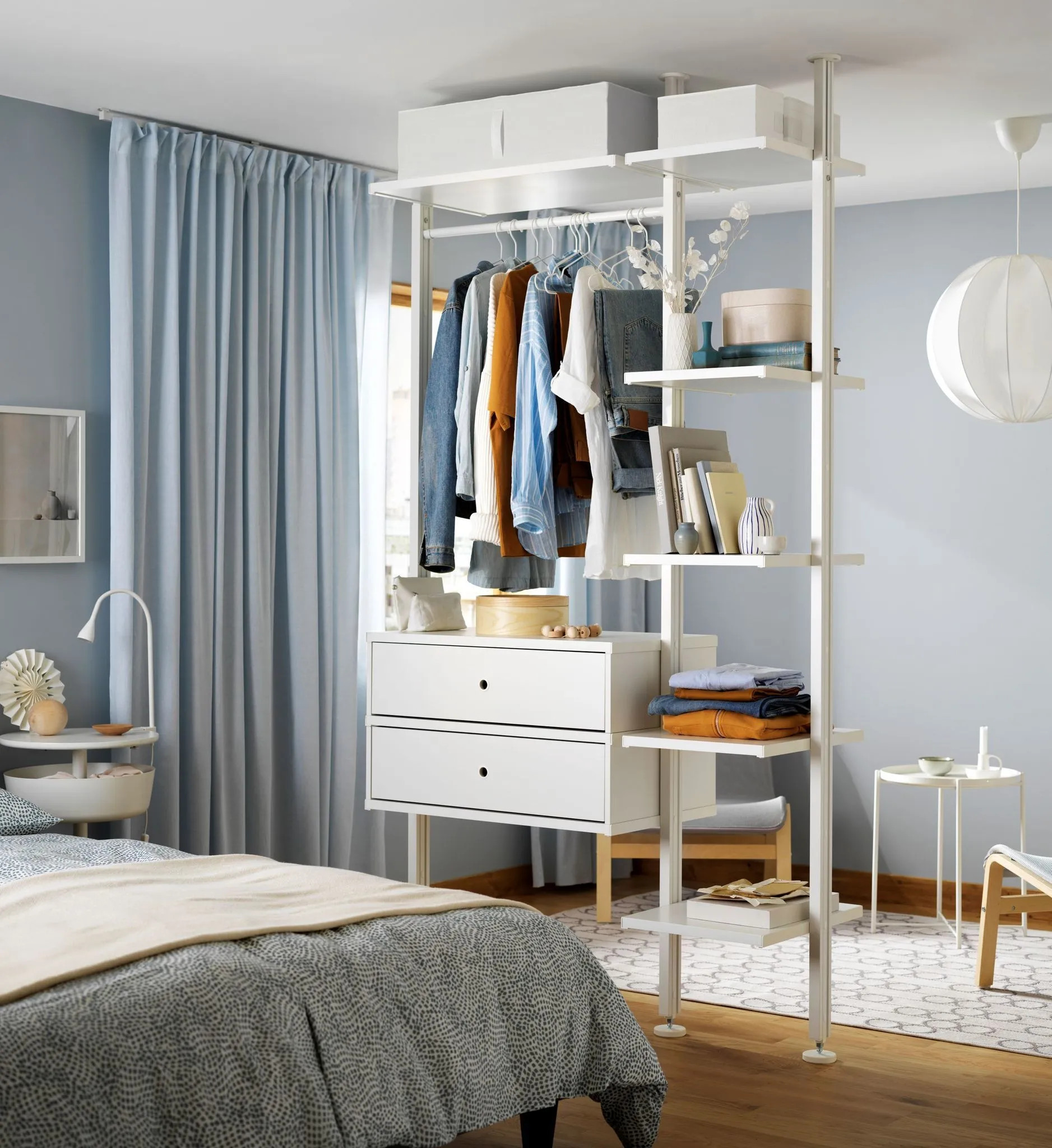 bed behind a wardrobe in a studio bed behind a wardrobe in a studio