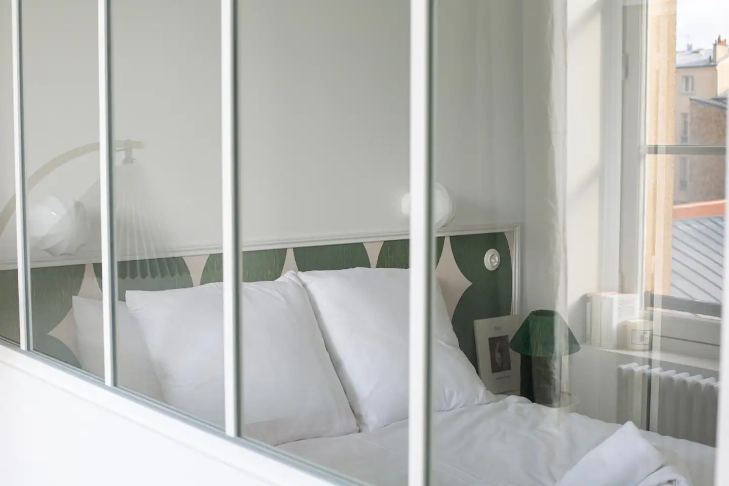 small bedroom in a studio transformed in a one-bedroom flat with a glass partition small bedroom in a studio transformed in a one-bedroom flat with a glass partition