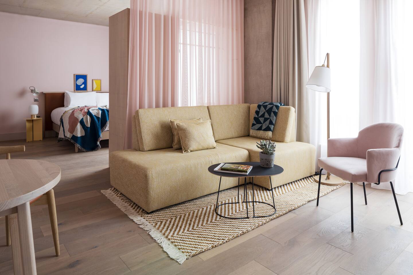 bedroom hidden behind a curtain in a designer studio bedroom hidden behind a curtain in a designer studio