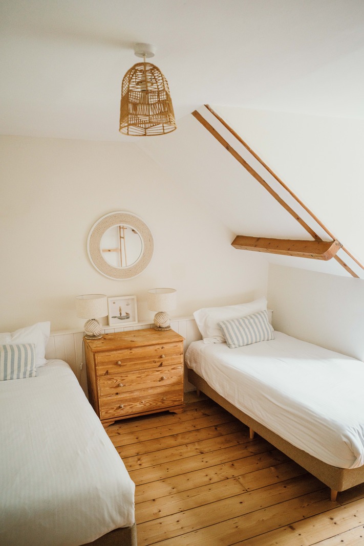 attic bedroom with two beds